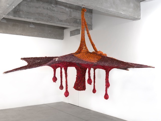 Ernesto Neto, Winter Flower, 2016. Cotton voile crochet, cotton voile thread balls, bamboo, semiprecious stones, wood and dry leaves, 138 x 147 x 148 in. C/O THE ARTIST AND TANYA BONAKDAR GALLERY