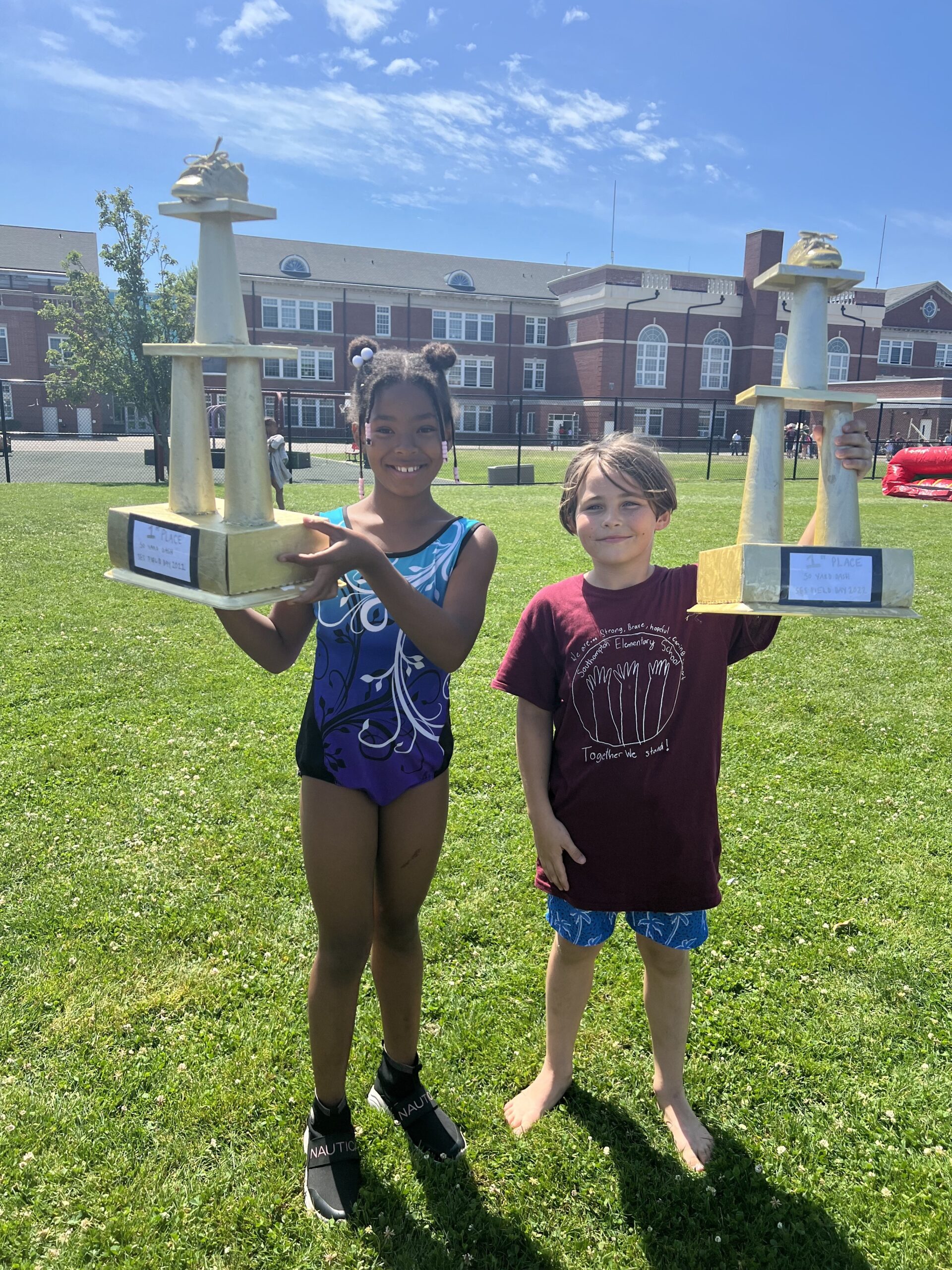 Brielle James and Jayden Styler each won a Golden Sneaker trophy for winning the 50-yard dash in their division during Southampton Elementary School's annual field day.  COURTESY SOUTHAMPTON SCHOOL DISTRICT