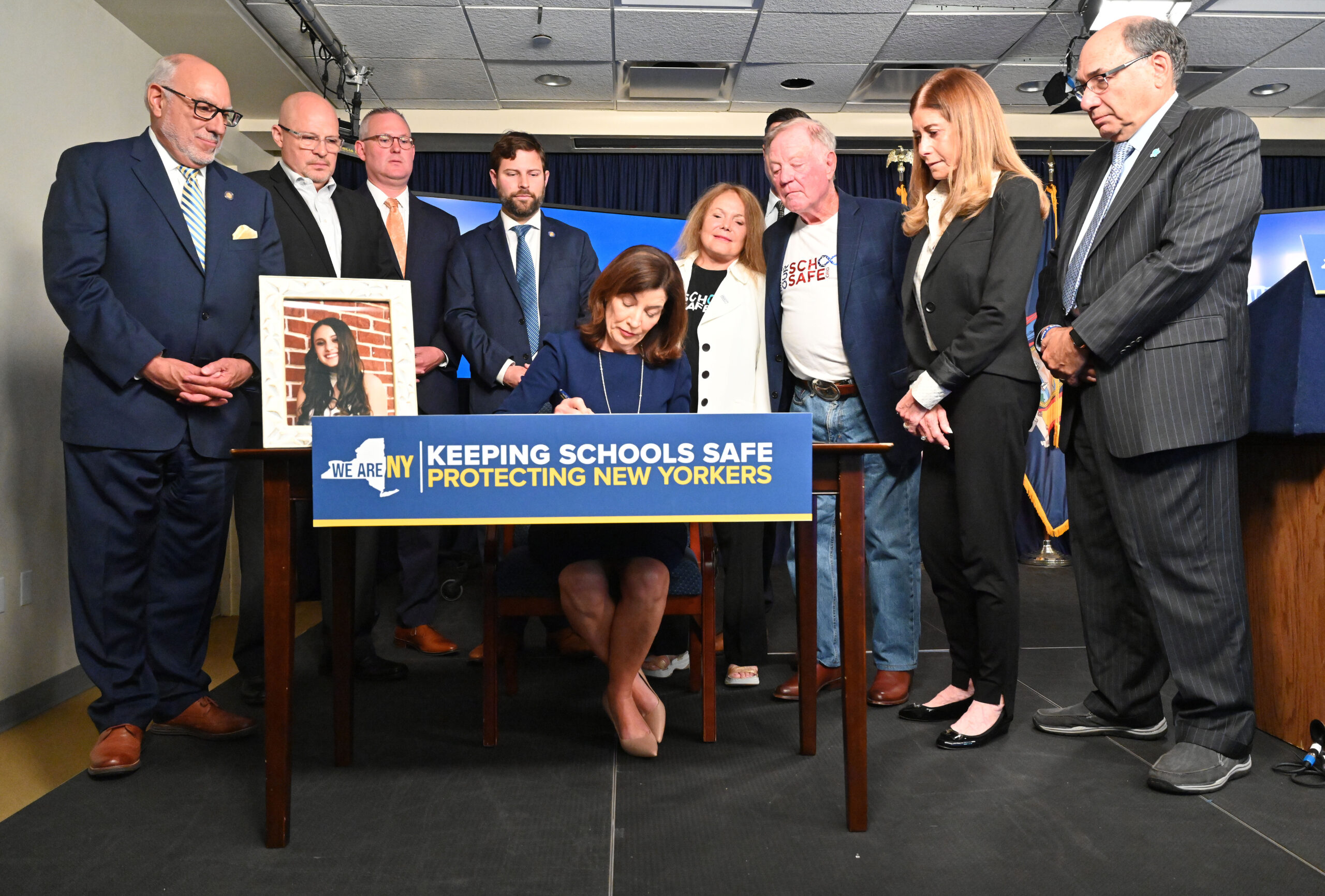 During a ceremony in New York City June 23, Governor Kathy Hochul signs Alyssa's Law to strengthen school safety, where districts would be required to consider installing silent panic alarms in classrooms. KEVIN P. COUGHLIN/OFFICE OF GOVERNOR KATHY HOCHUL