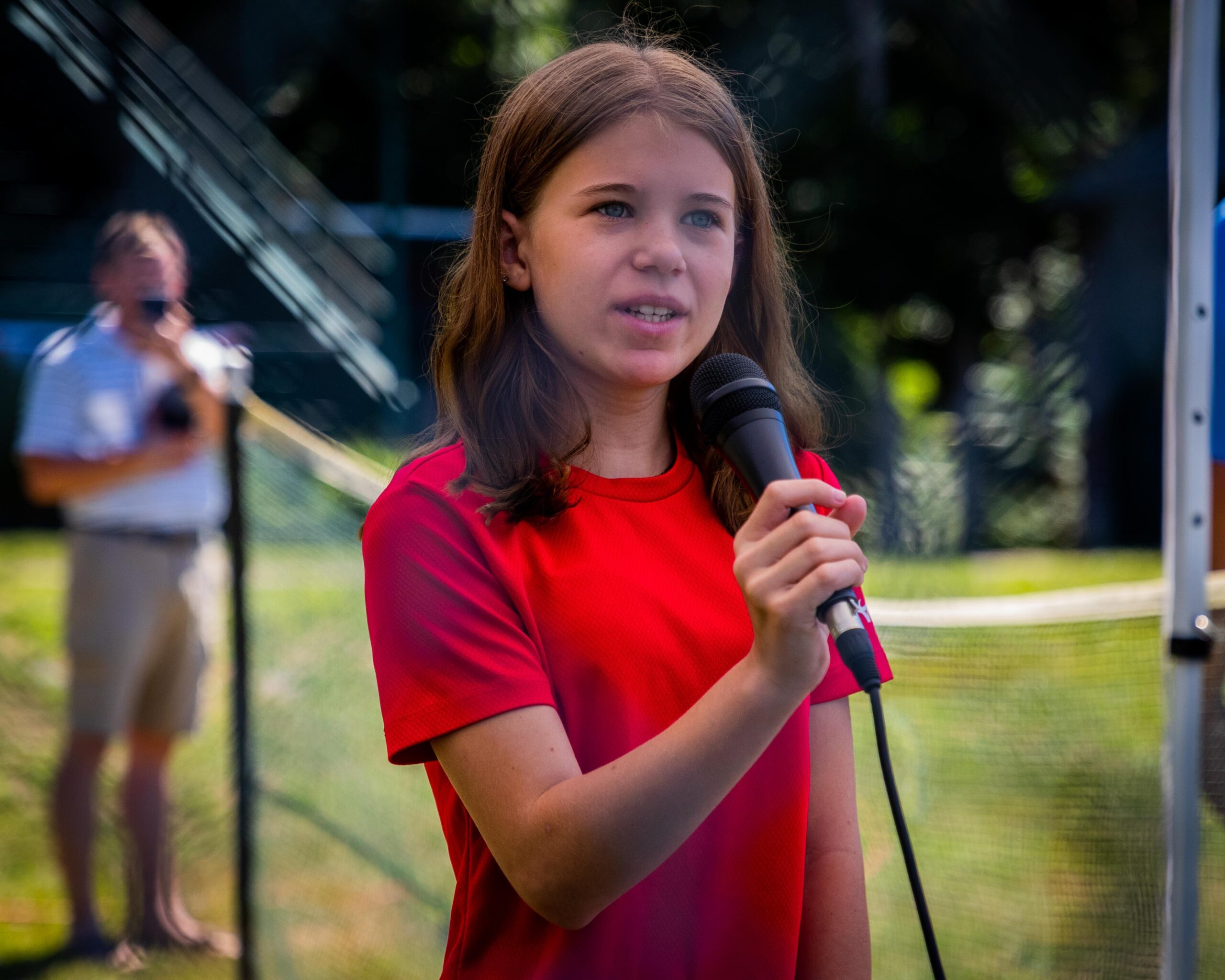 A youngster sings the National Anthem prior to Monday's game between the Sag Harbor Whalers and Shelter Island Bucks.    DEMETRIUS KAZANAS