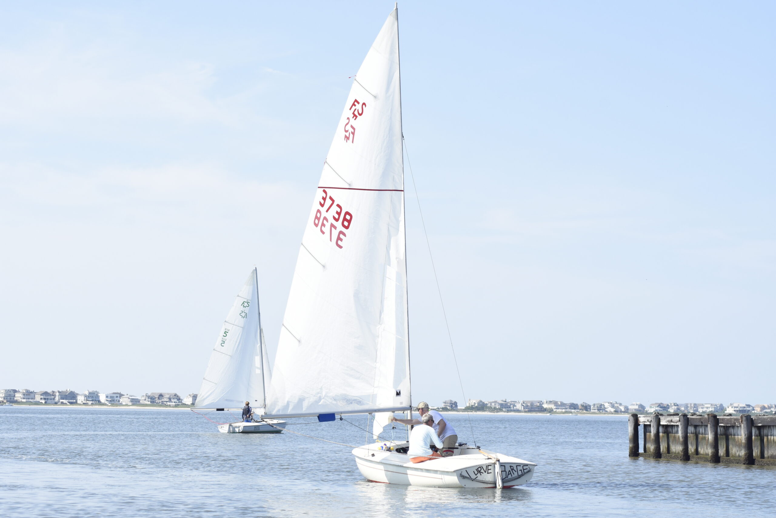 Sailors head out on to Moriches Bay for sailing for the Sis Rice Minsch Memorial Trophy.    DREW BUDD