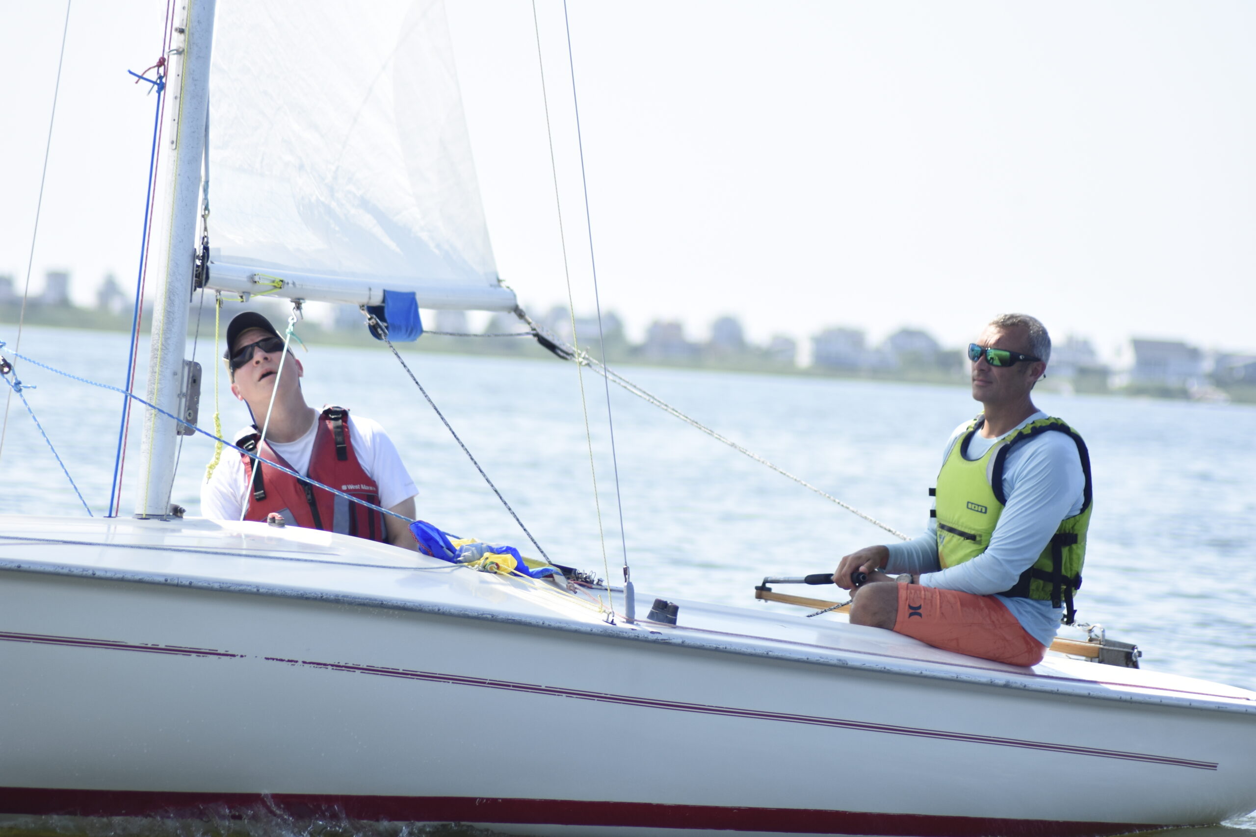 Mike DiSario and Matt Roden make sure everything looks good with their sail.  DREW BUDD
