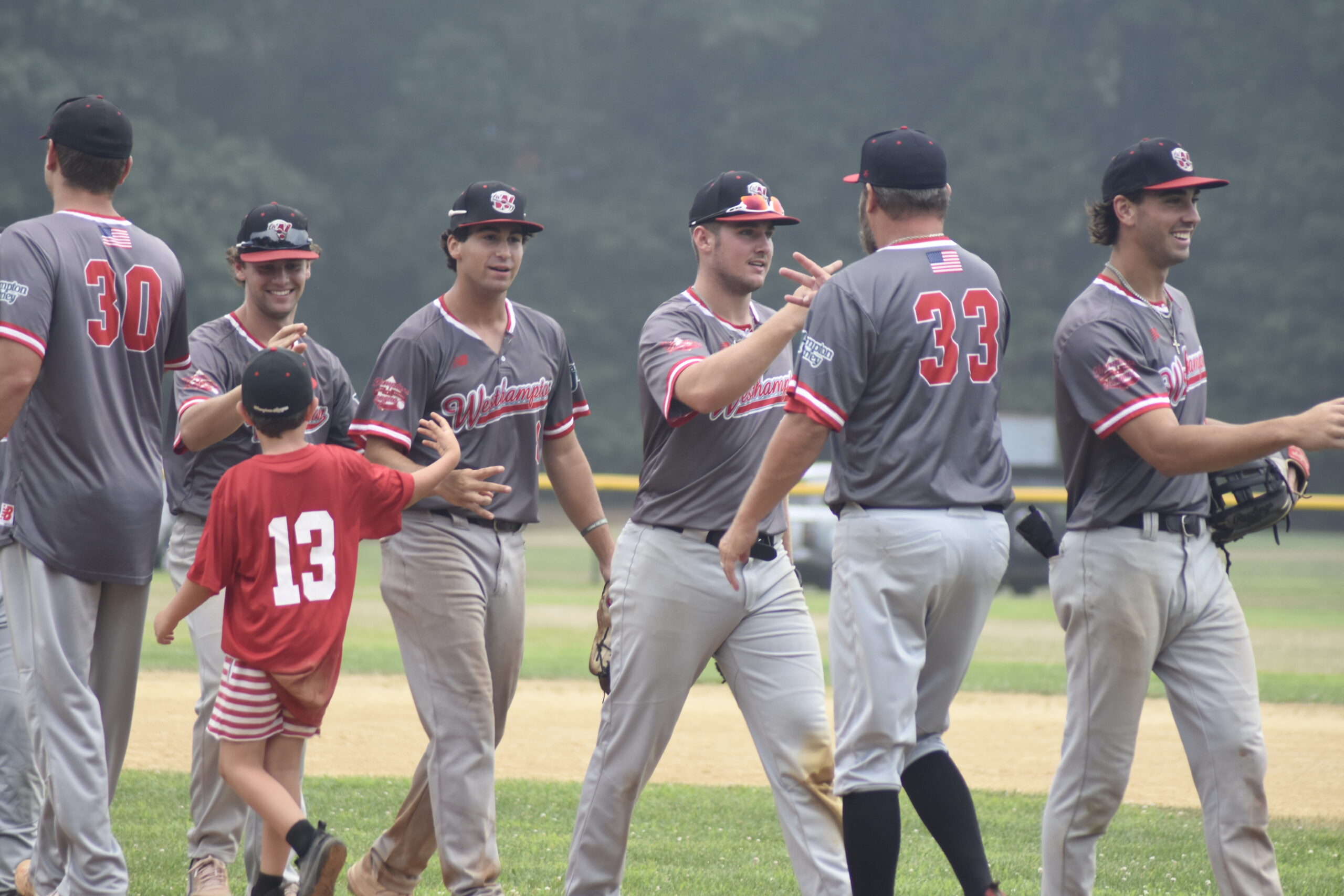 The Aviators are all smiles after their come-from-behind 2-1 victory over South Shore in Bellport on Thursday, July 28, advanced them to the HCBL Championships.    DREW BUDD