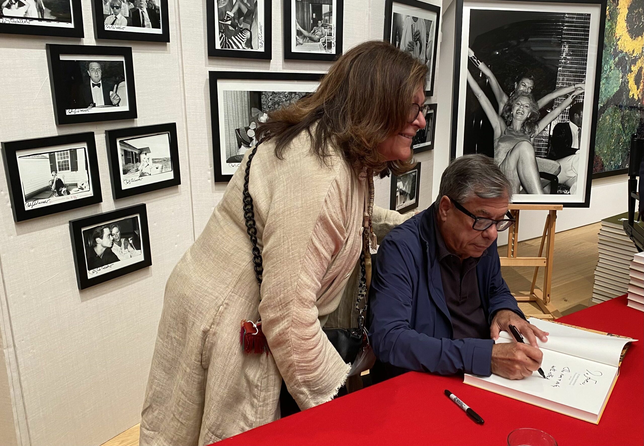 Bob Colacello on June 16 signing a copy of his book of photos, 