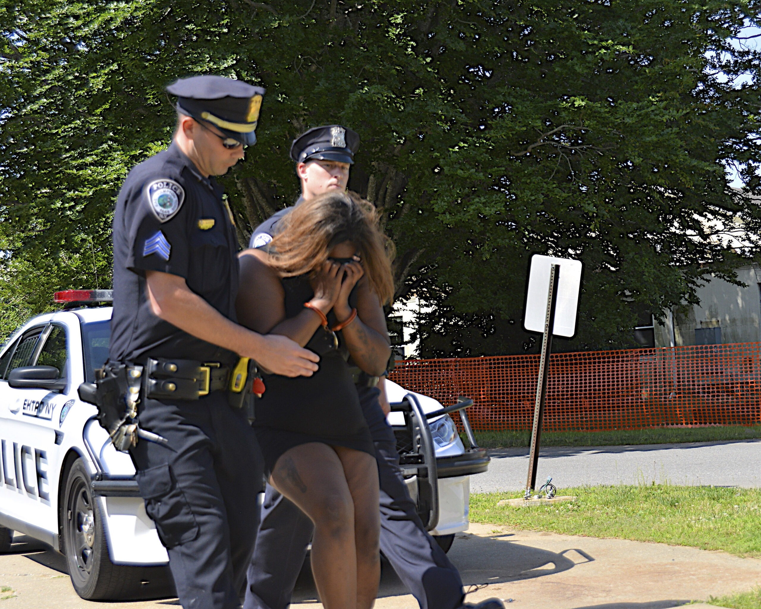 Tenia Campbell being led to her arraignment in East Hampton in July of 2019.