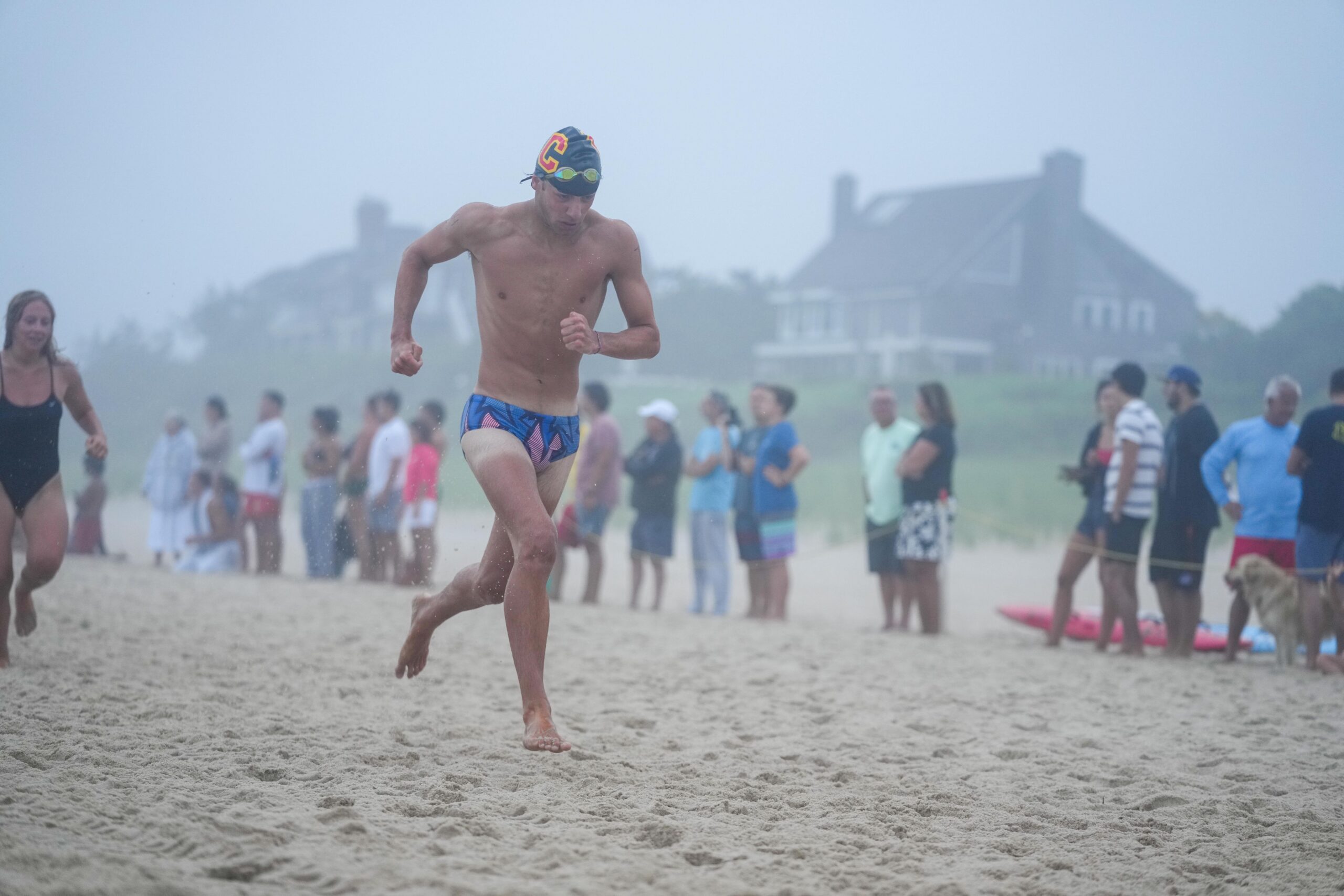 A guard races toward the finish line in the distance swim.   RON ESPOSITO