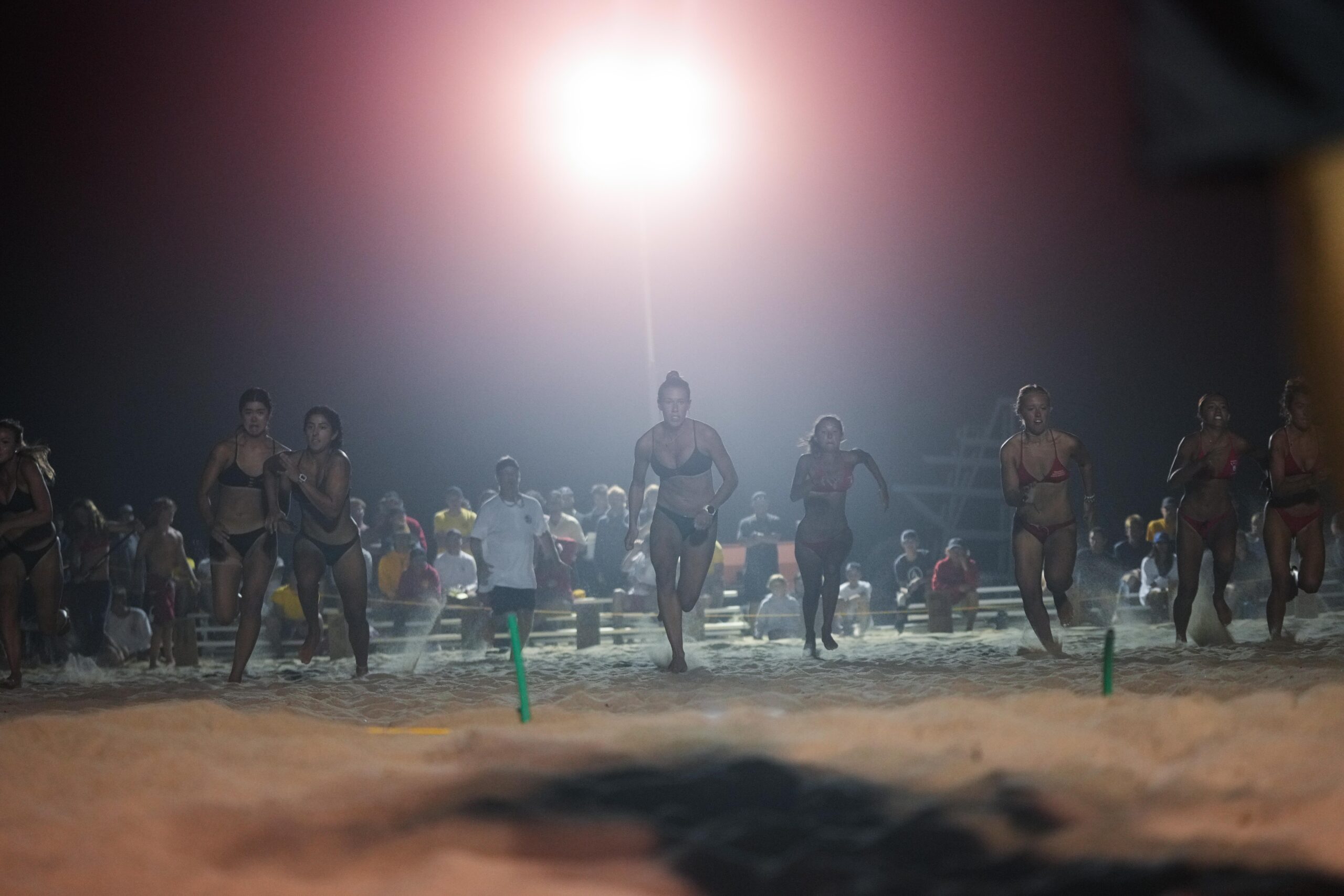 The women compete in their beach flags event.    RON ESPOSITO