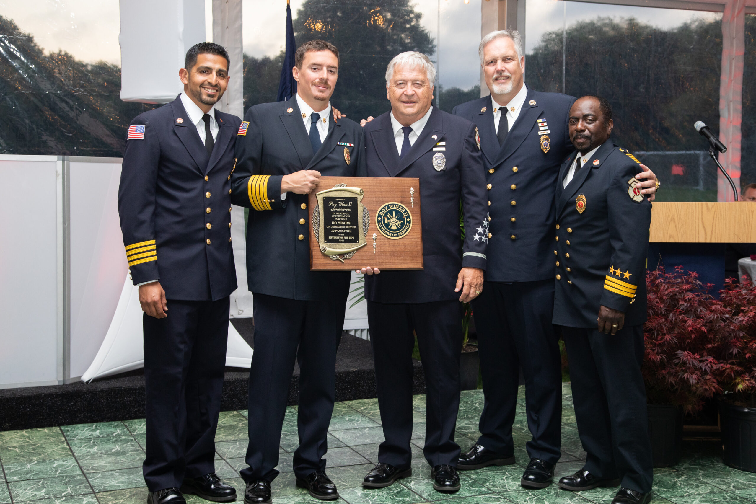 Southampton Fire Department honored two longtime members for 50 years of service -- William Culver and Roy Wines III -- at its annual dinner in June. From left, First Assistant Chief Manny Escobar, Chief Alfred Callahan, Roy Wines III, 