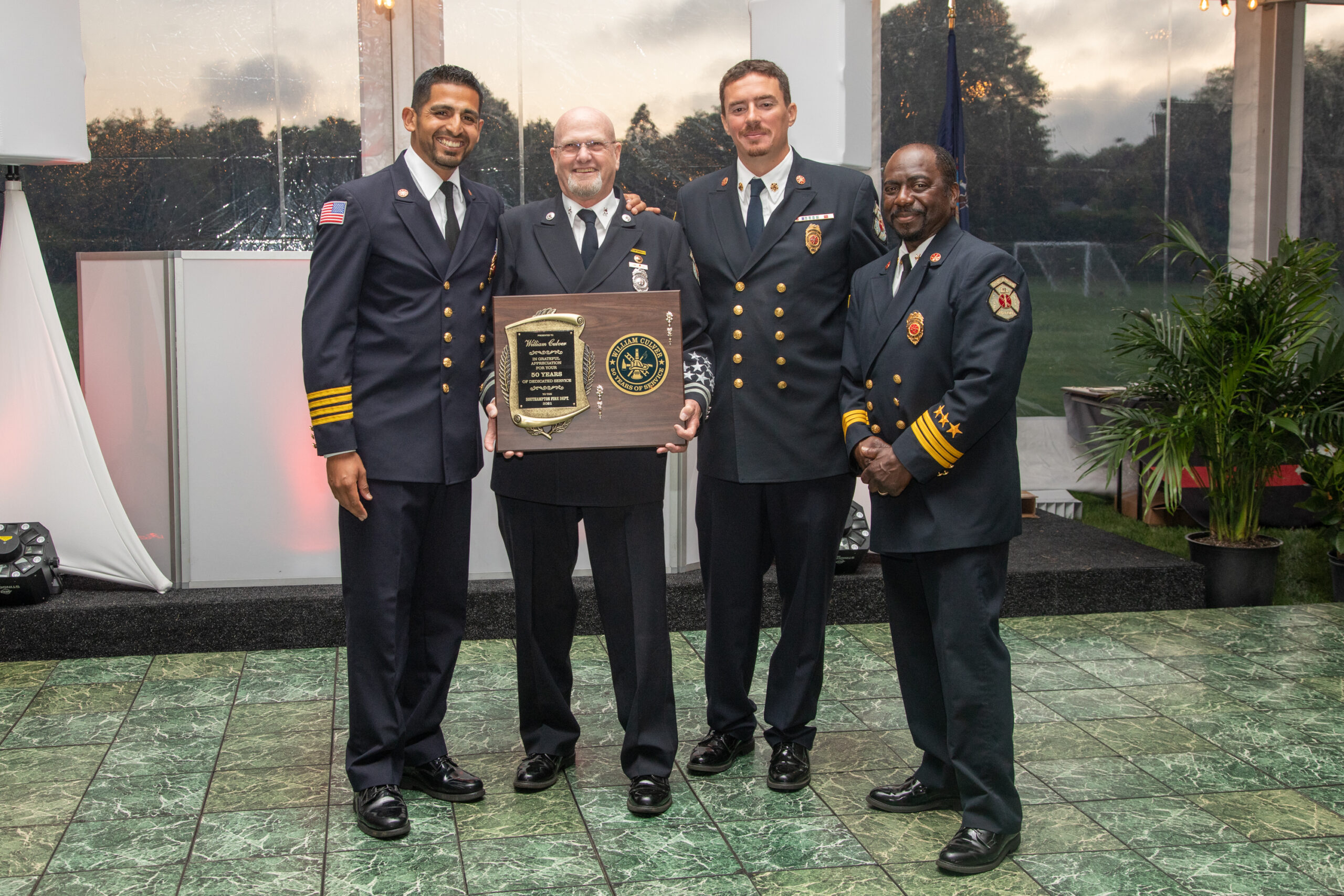 Southampton Fire Department honored two longtime members for 50 years of service -- William Culver and Roy Wines III -- at its annual dinner in June. From left, First Assistant Chief Manny Escobar, William Culver, Chief Alfred Callahan and Second Assistant Chief Polis Walker. COURTESY SOUTHAMPTON FIRE DEPARTMENT.