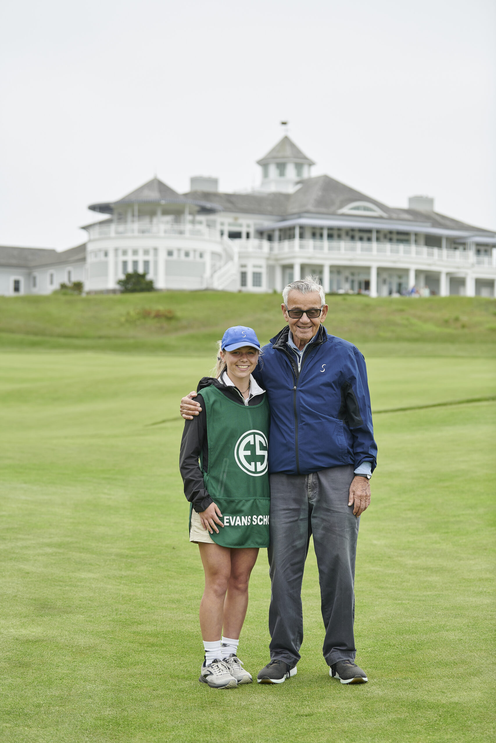 Abbey Sisler, a Wading River resident, with Sebonack Golf Club owner Michael Pascucci. Sisler will attend the University of Maryland on a full ride courtesy of the Chick Evans Scholarship, which she earned through her work as a caddy at Sebonack over the last three years. TODOR TSVETKOV PHOTOS