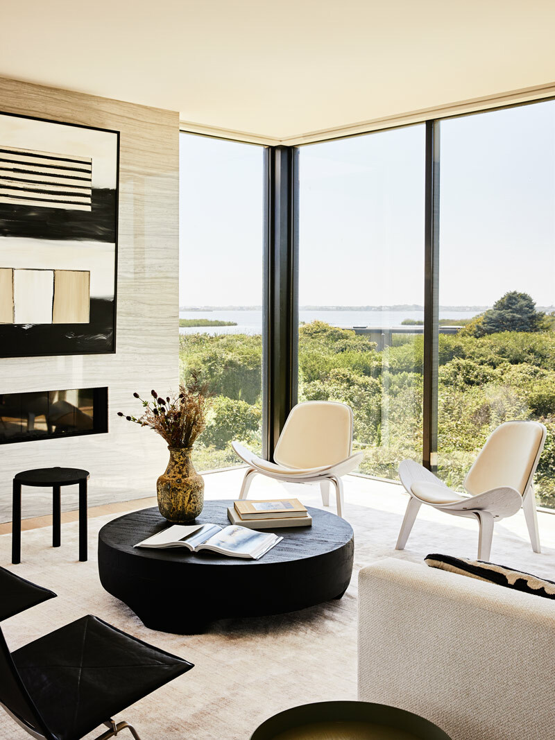 A Pair of mid-century modern chairs in this contemporary living room on Jobs Lane in Bridgehampton.  