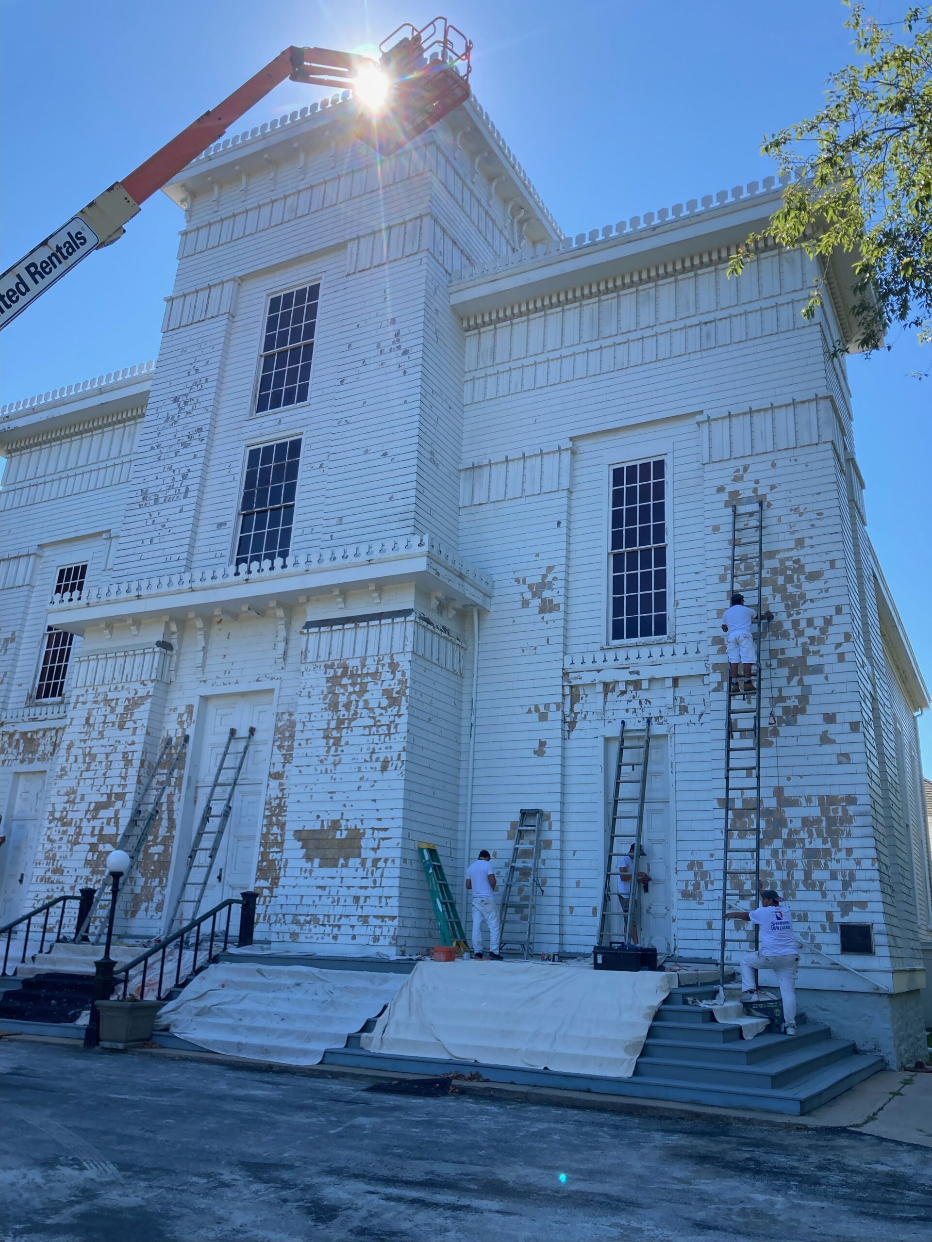 Workers started to repaint the facade of the Old Whalers' Church in Sag Harbor last week. ED DEYERMOND