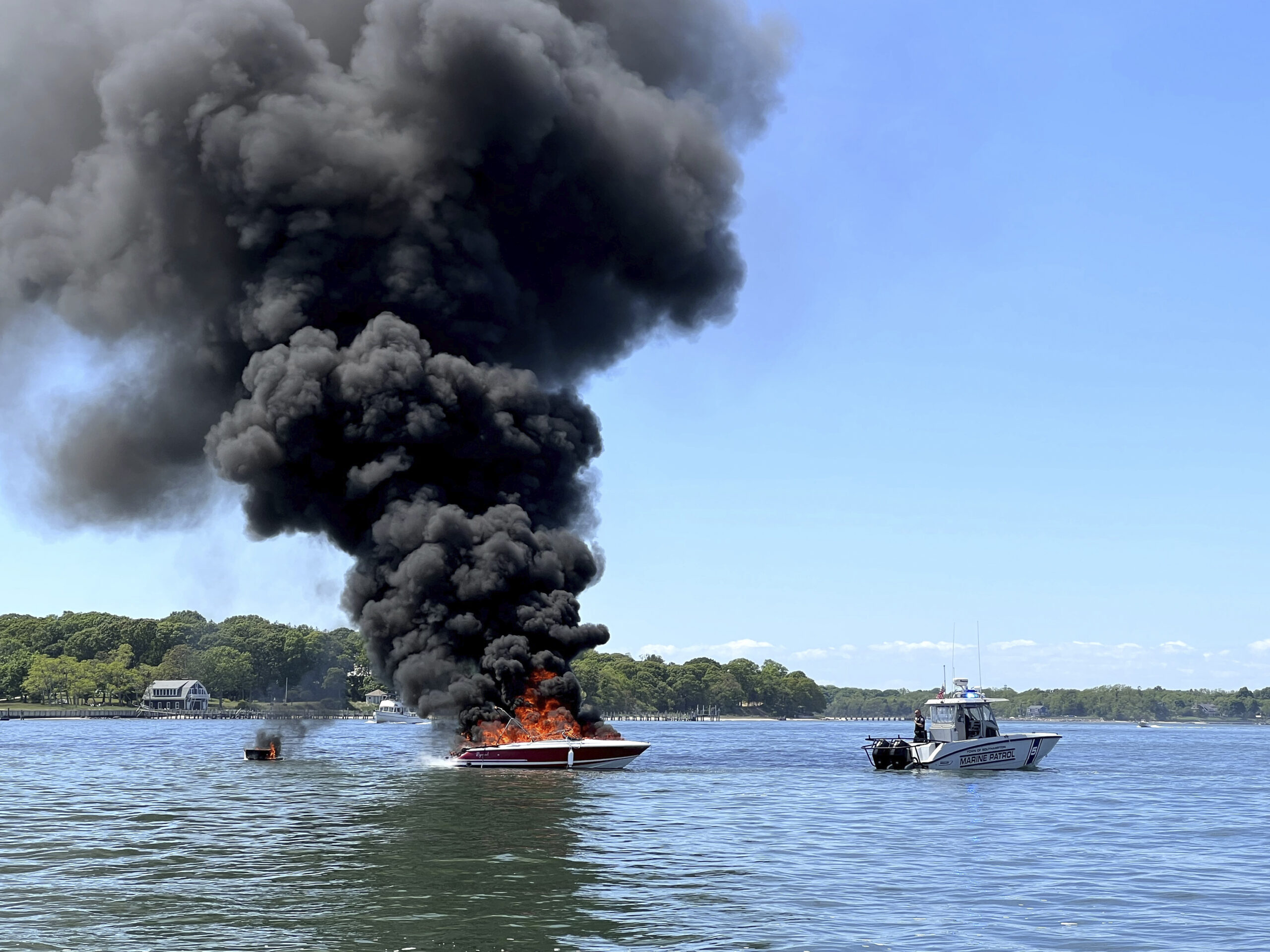 Fires like the one that engulfed this powerboat off North Haven last May demonstrate the need for a new fireboat for the Sag Harbor Fire Department, volunteers say. PETER BOODY
