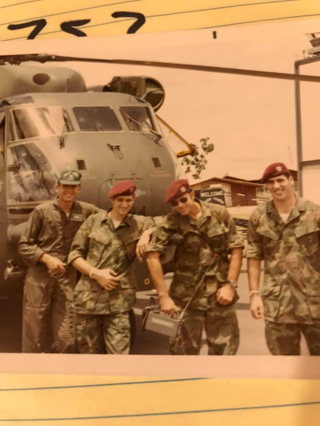 HH-53 Super Jolly Green rescue helicopter with pilot and three pararescuemen standing alert for their next mission during the Vietnam War.  William Hughes is at the far right.