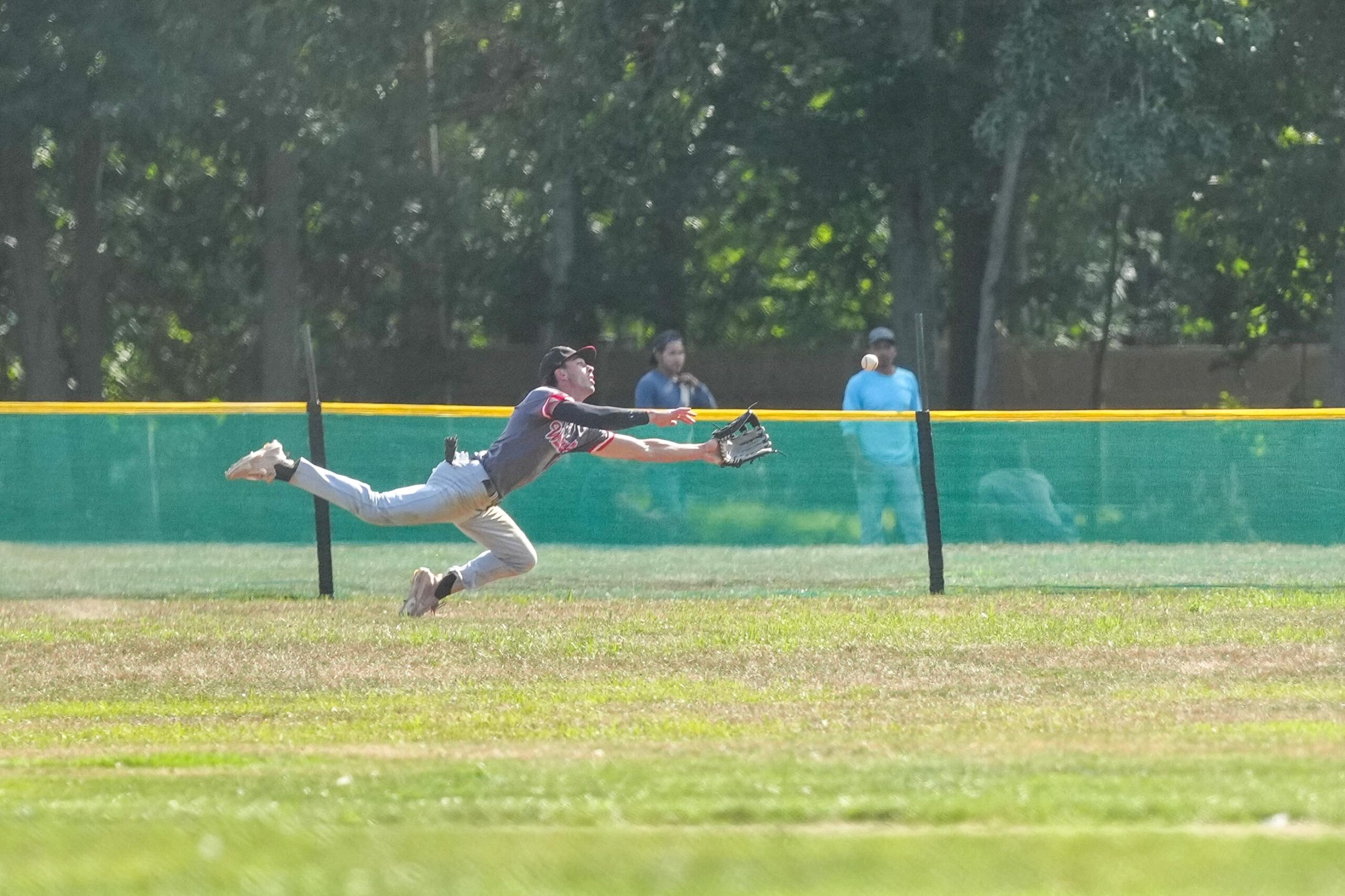Aviator Alex Ungar (Brookdale) makes a diving play in center field early in the game.    RON ESPOSITO