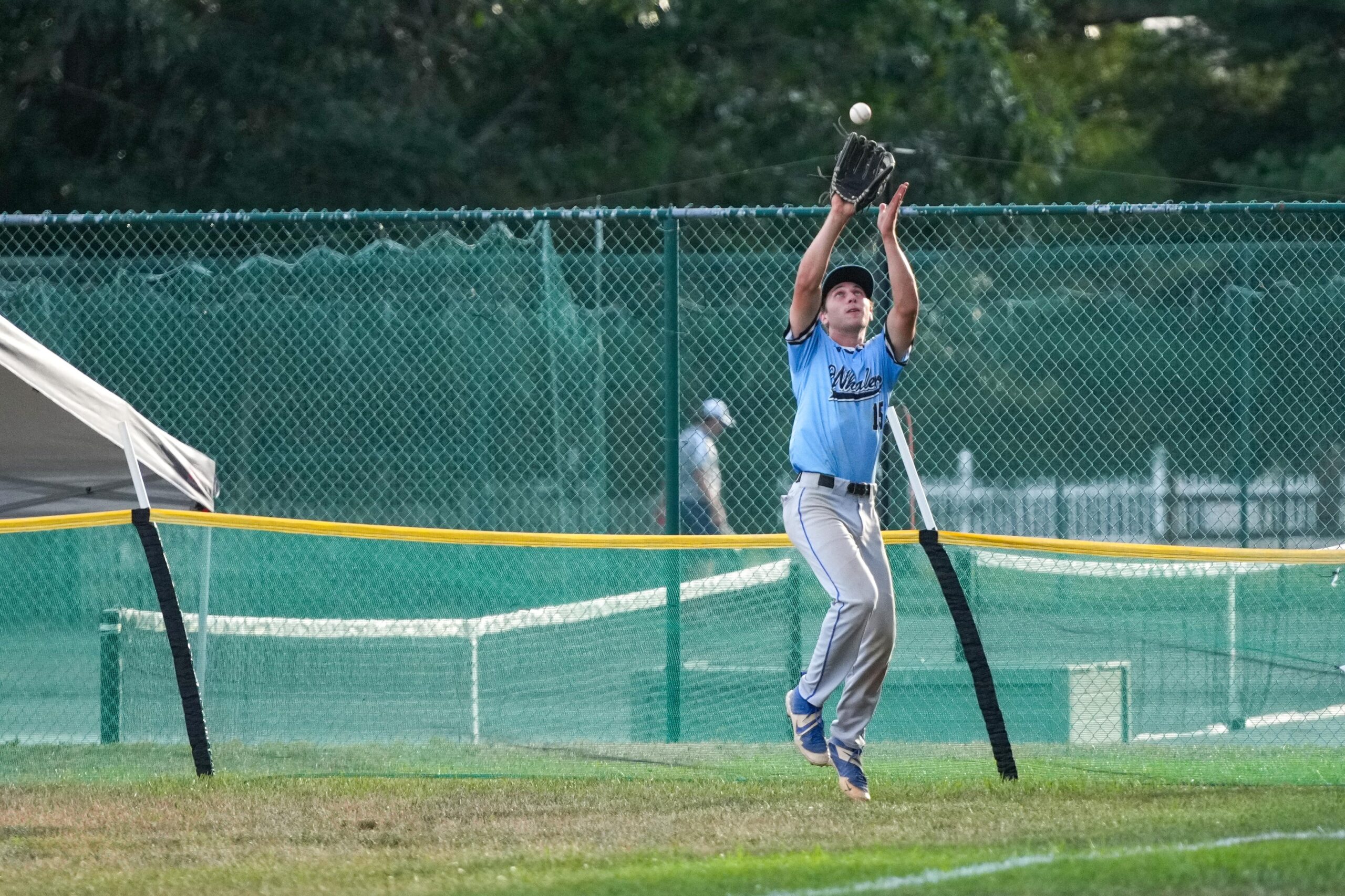 Sag Harbor rightfielder Jackson Sattinger (Hamilton) catches a deep fly ball right along the fence.   RON ESPOSITO