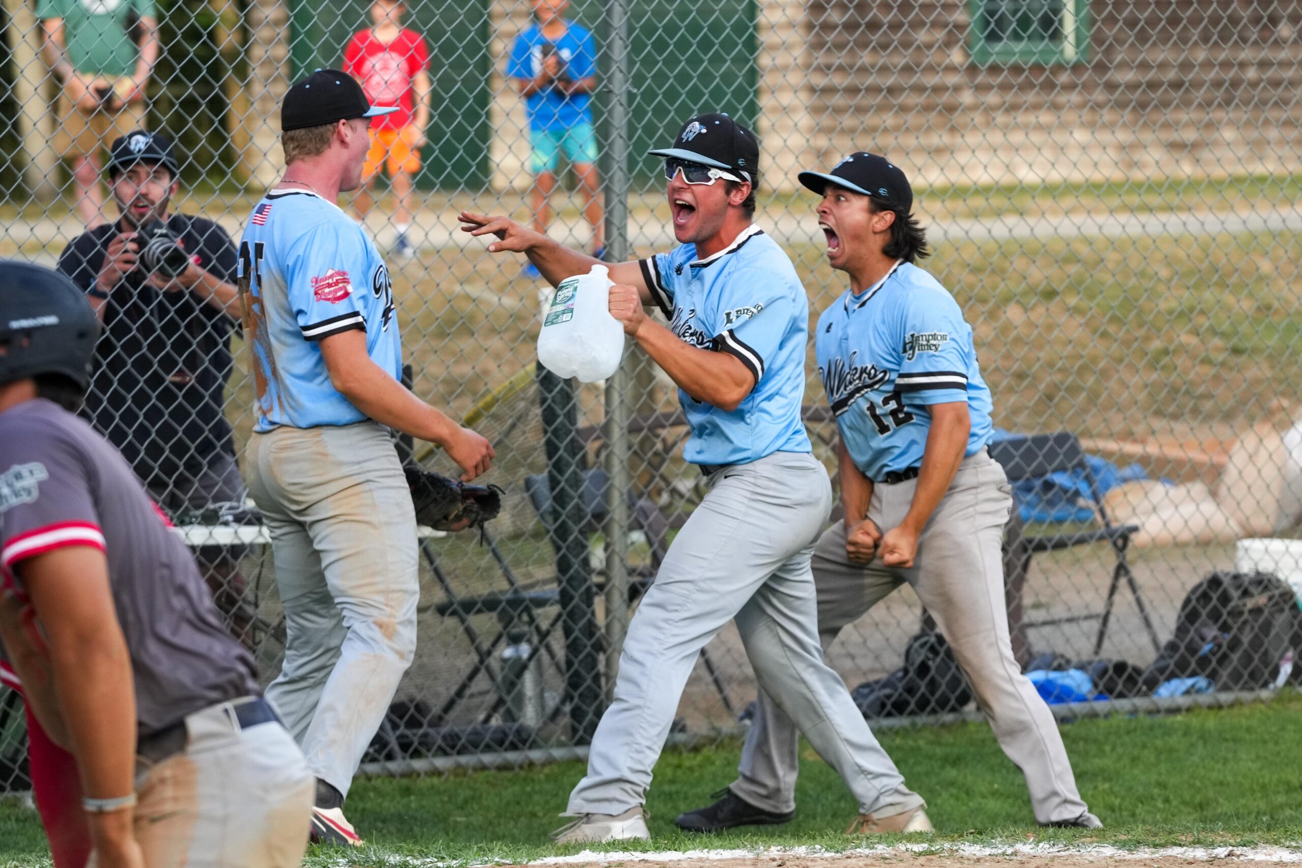 Cole Wong (12) and the Whalers are fired up after they were able to get the Aviators trying to score the go-ahead run in the top of the ninth on a wild pitch.   RON ESPOSITO