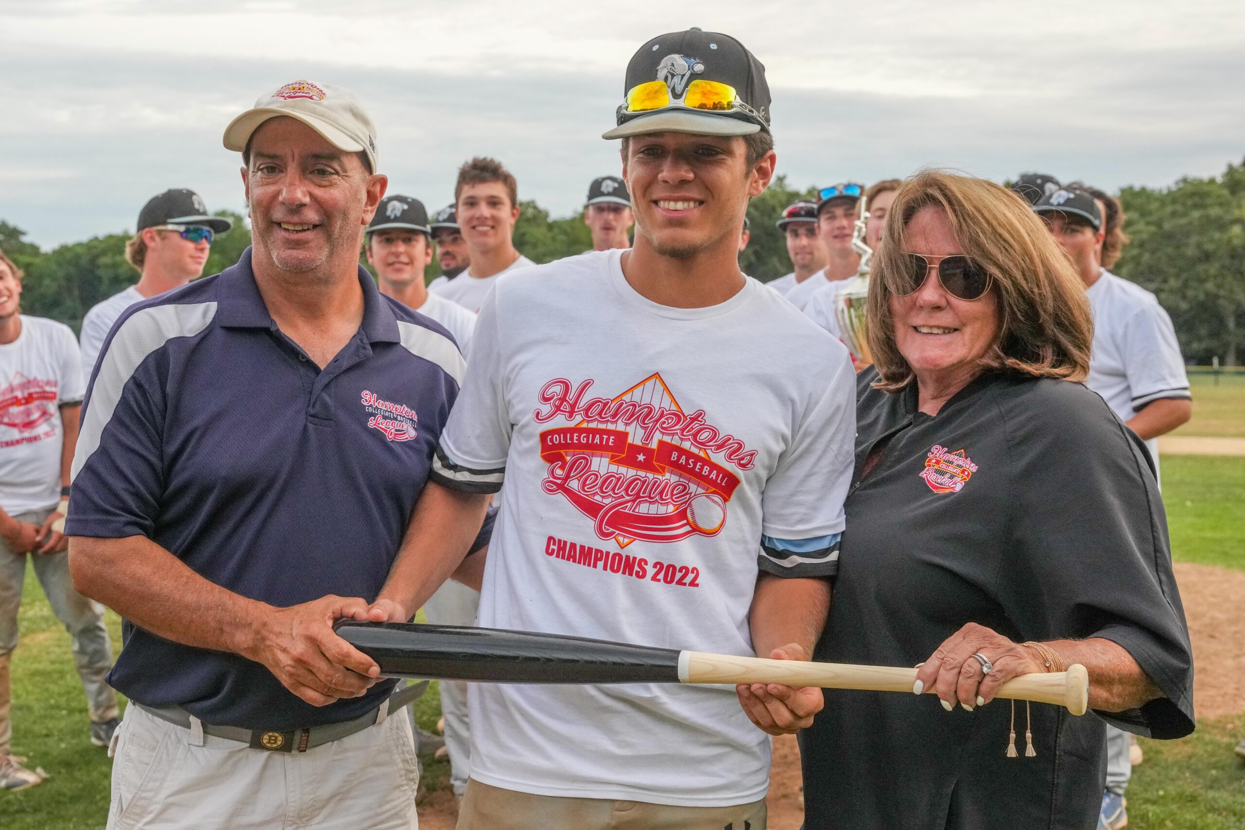 Cam Santerre (Rhode Island), with HCBL Commissioner Jim Pereira and president Sandi Kruel, was named MVP of the championship series.   RON ESPOSITO