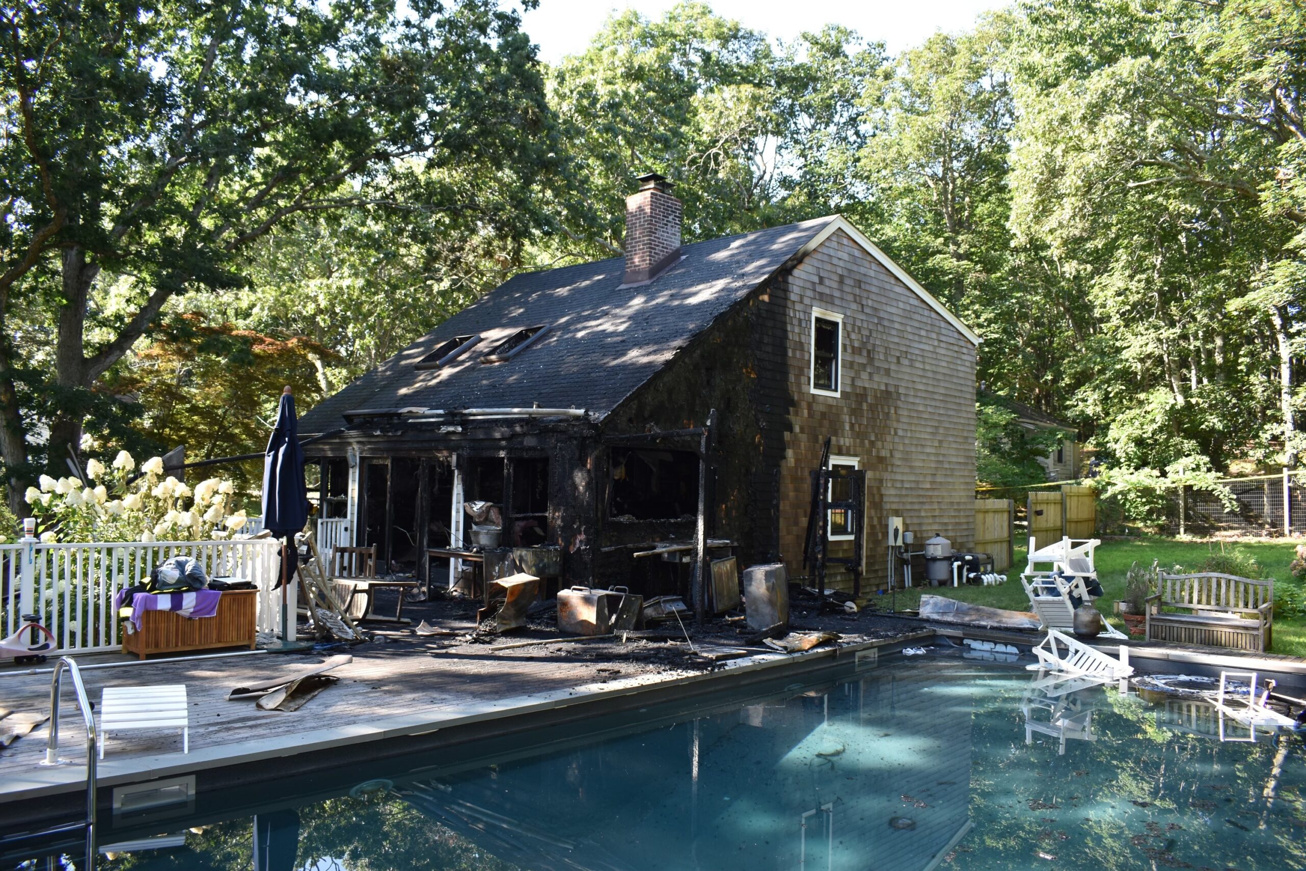 The fire that killed two Maryland sisters started near an outdoor kitchen that charges against the homeowners this week revealed was built without building permits, had not been inspected and had an improperly installed electrical outlet that investigators said posed a fire hazard.