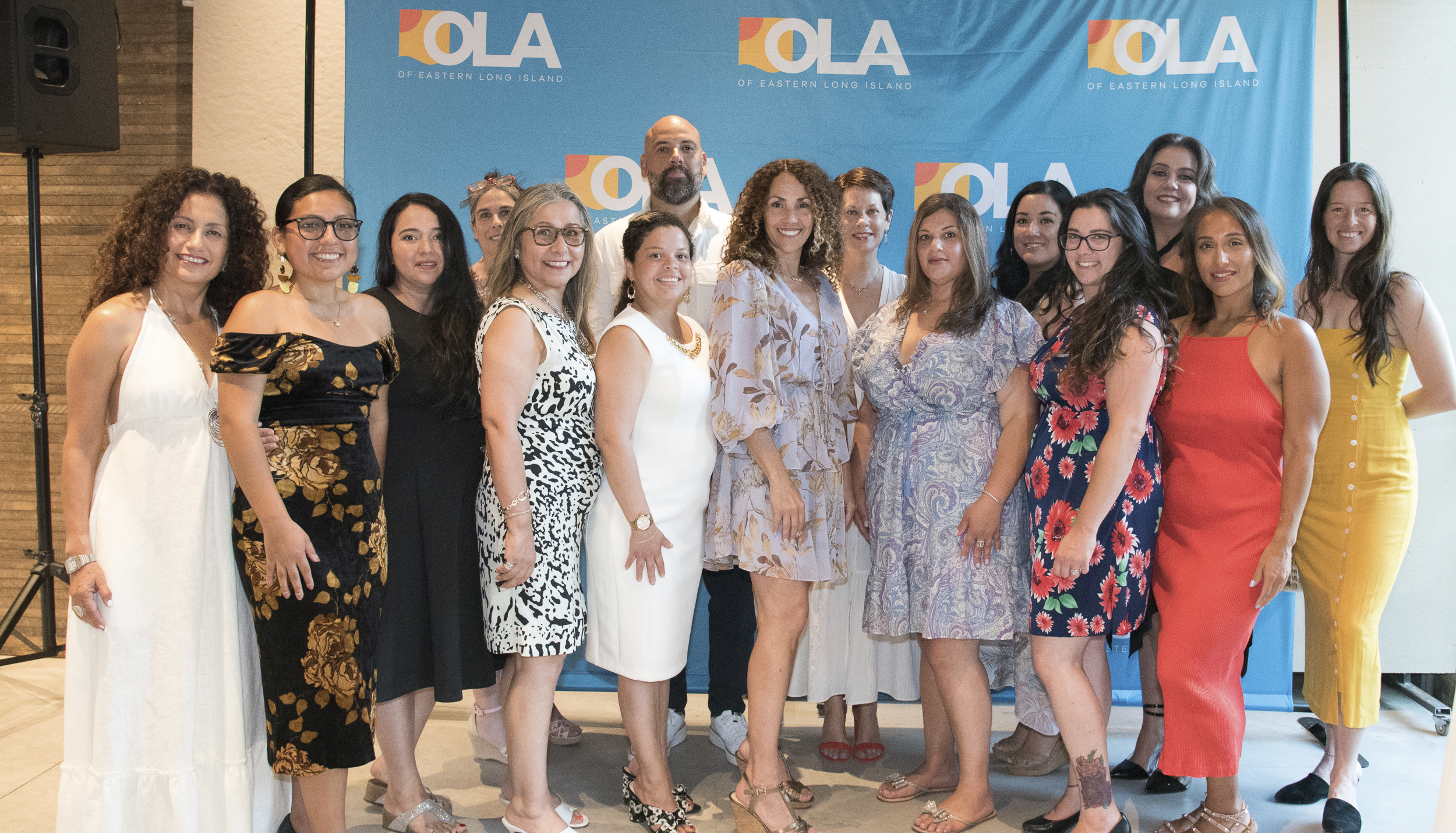 OLA Executive Director Minerva Perez ,center, with the OLA team
