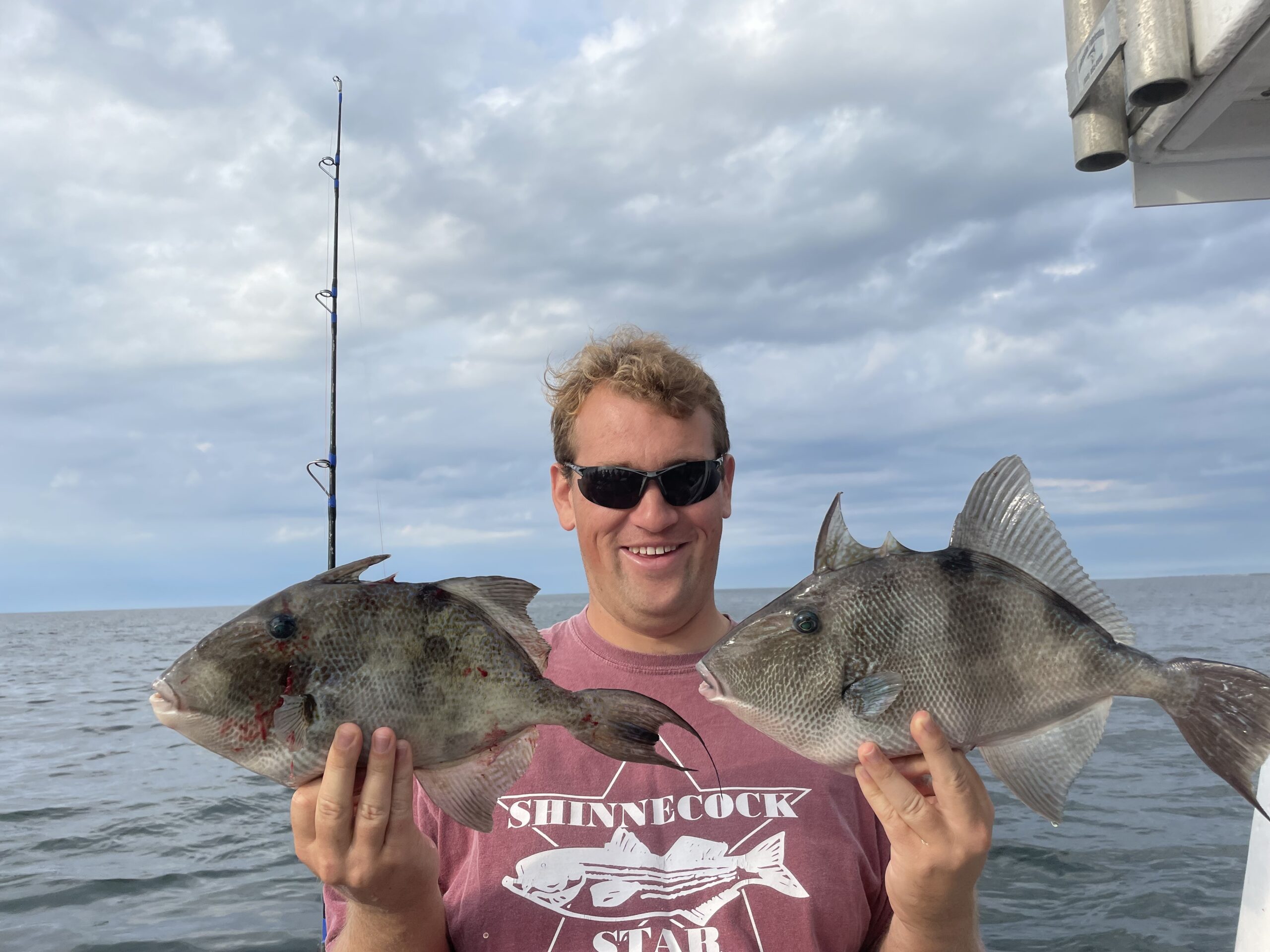 Matt Panagos with a couple of nice triggerfish caught aboard the Shinnecock Star out of Hampton Bays recently.  Deena Lippman/Shinnecock Star