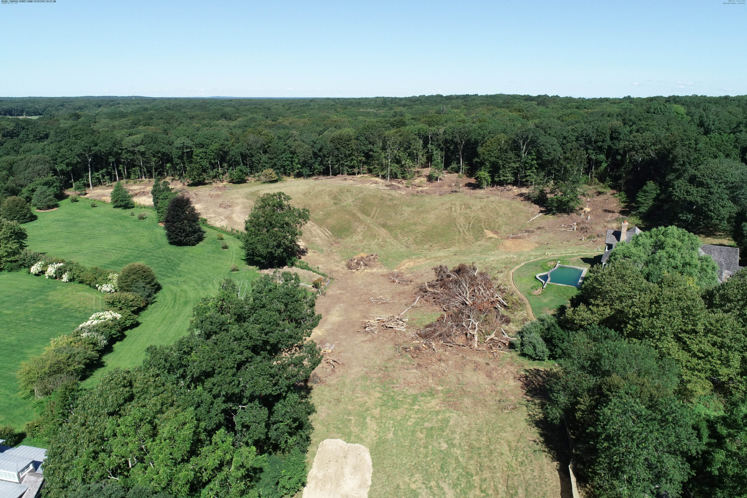 The Peconic Land Trust sued Randy Lerner in 2019 after Lerner cut down trees around a pasture on land he purchased adjacent to his house on Town Lane. He says he plans to use the land, which is part of the agricultural reserve for the Stony Hill subdivision, as an orchard or to grow pumpkins but the Trust says an easement precluded the removal of trees regardless of the purpose.      COURTESY PECONIC LAND TRUST