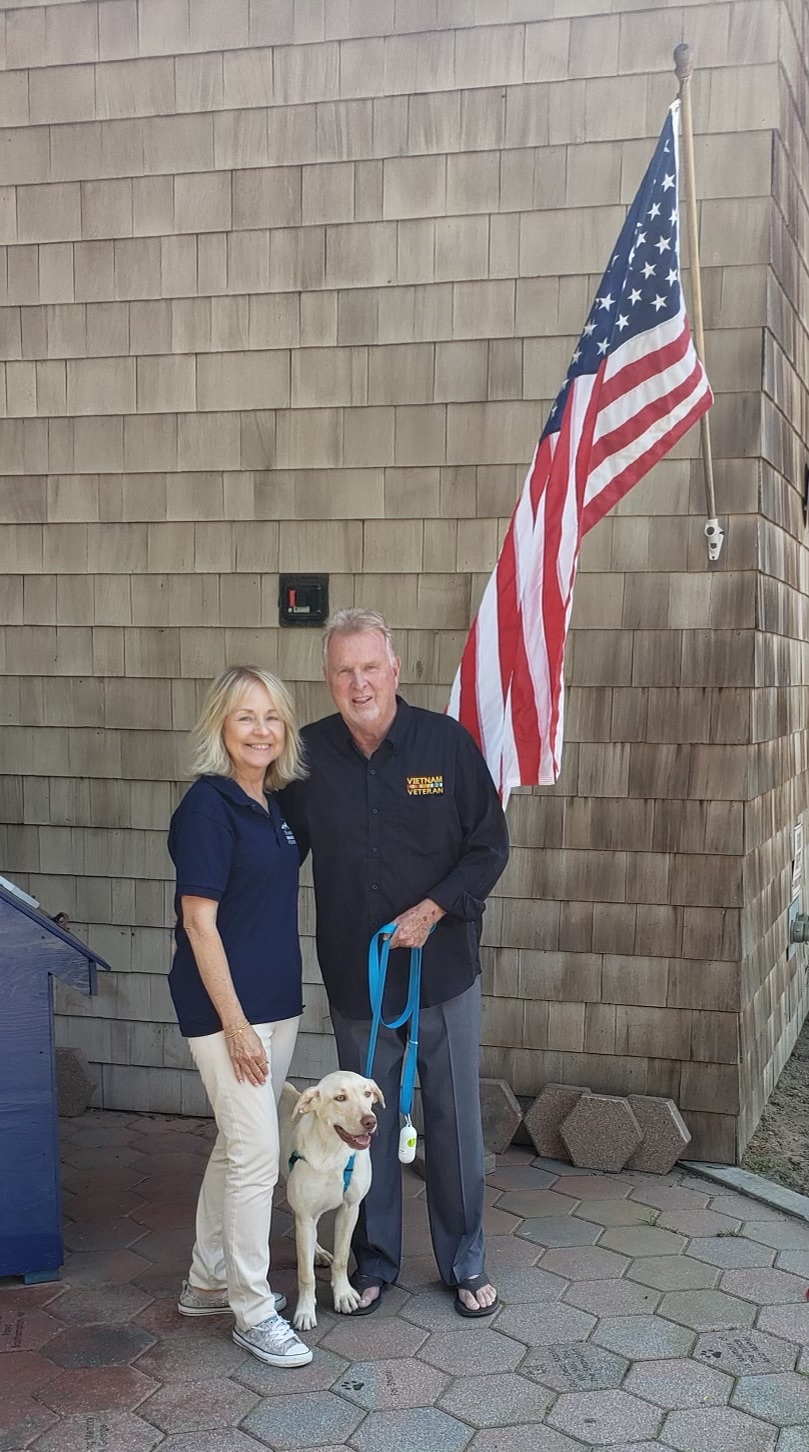 SASF Executive Director Pat Deshong, left, with Chris Quirin and his dog, Layla.