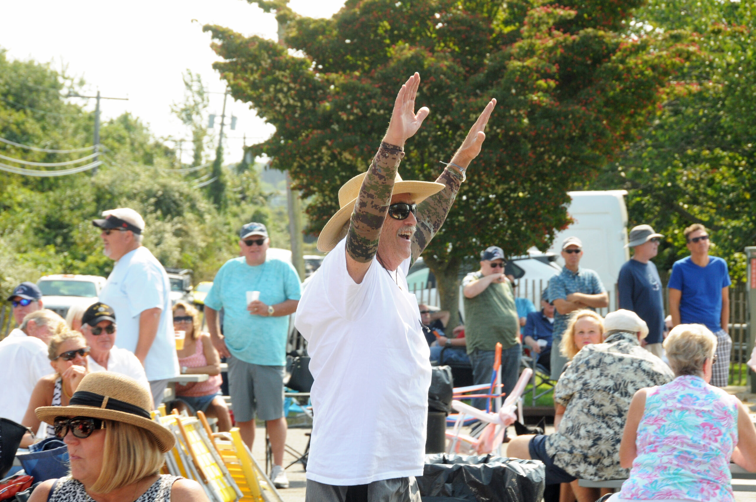 John Gale celebrates as his is the first ticket drawn from the drum at the Montauk Fire Department's Big Bucks Bonanza on Sunday. Since 1983, the Montauk Fire Department's Big Bucks Bonanza has given away 1,641 prizes totaling $4,955,500.00 in prize money.  Proceeds from the Bonanza go to a scholarship fund for Montauk youth.      RICHARD LEWIN