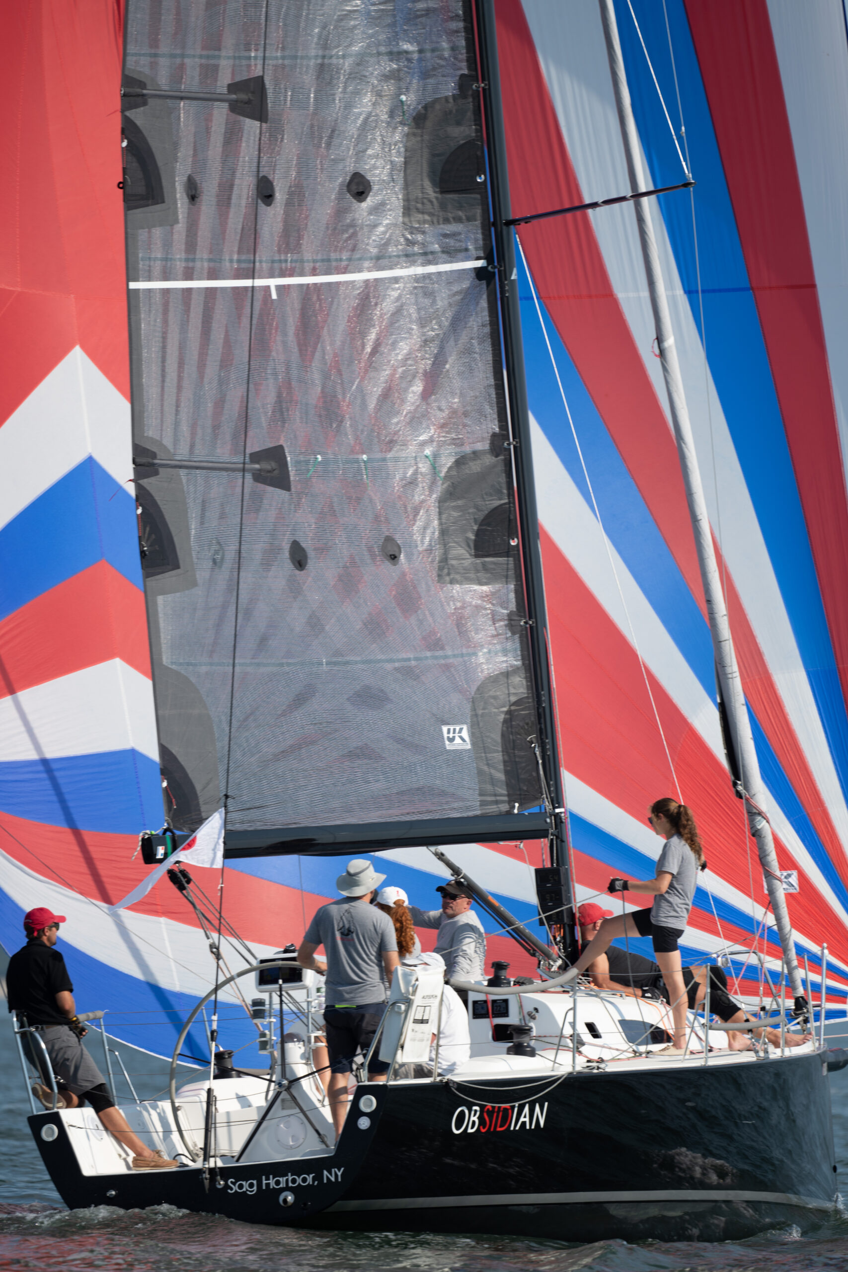 Obsidian with its large red, white and blue spinnaker out.  GARY SENFT/EASTENDMARINEPHOTOGRAPHY.COM