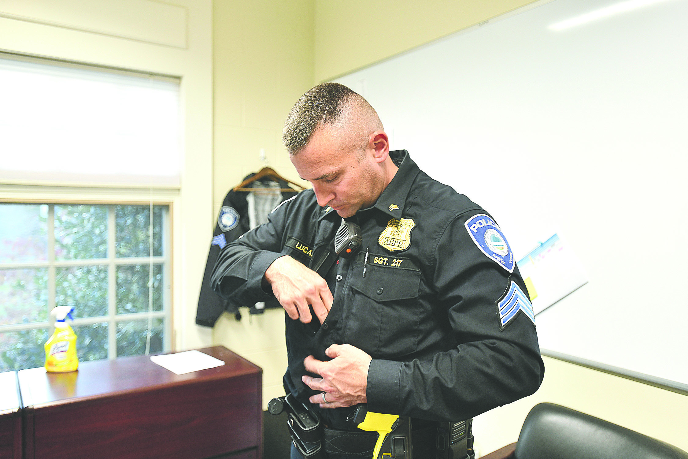 Lieutenant Ryan Lucas displayed his bodycam during a discussion of the technology  earlier this year. The Westampton Beach Village Police Department pioneered the use of the technology on the East End.