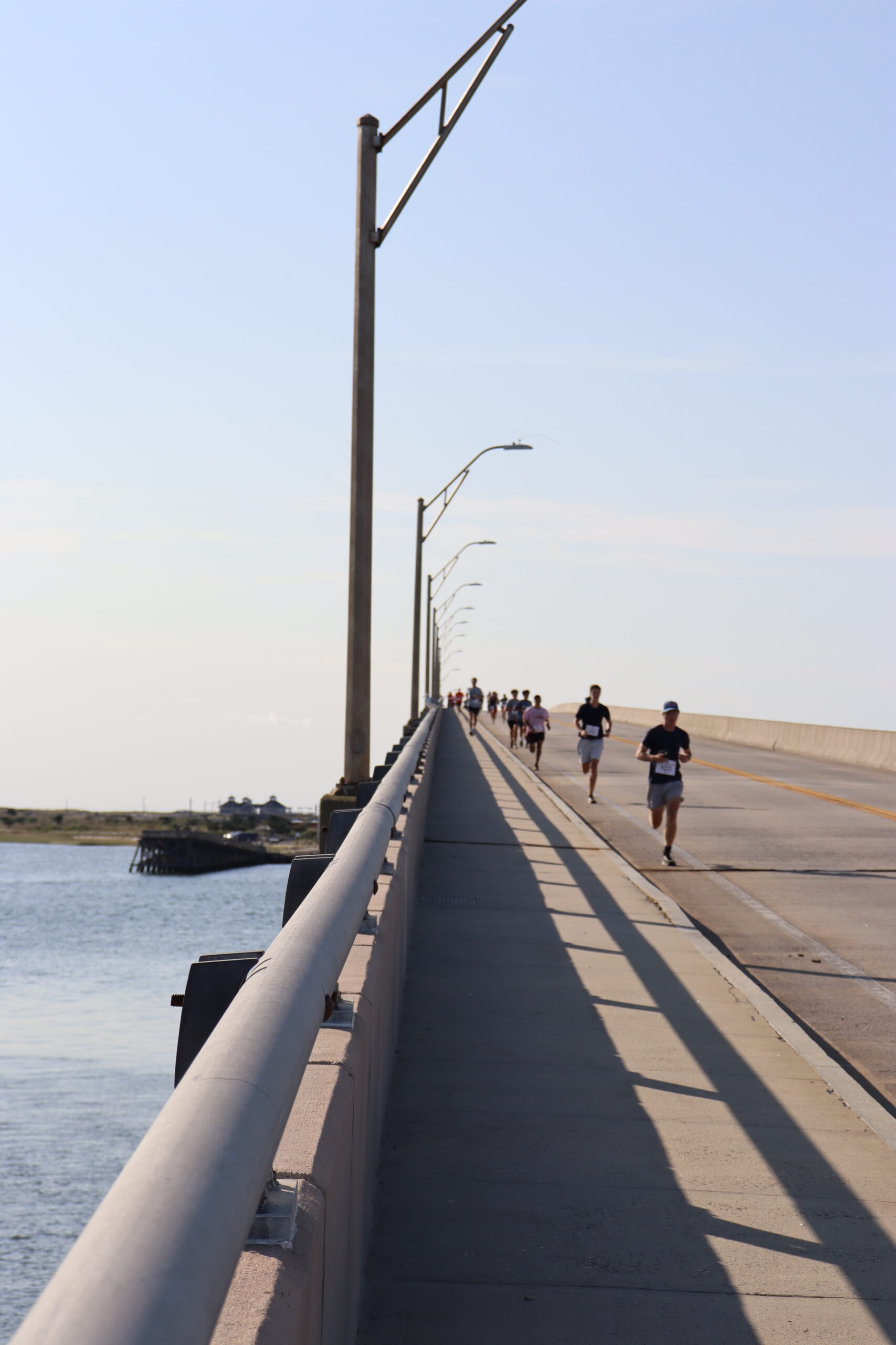 Runners come over the Ponquogue Bridge in Hampton Bays in the 11th annual Over the Bridge 5K and 10K on Saturday. CAILIN RILEY