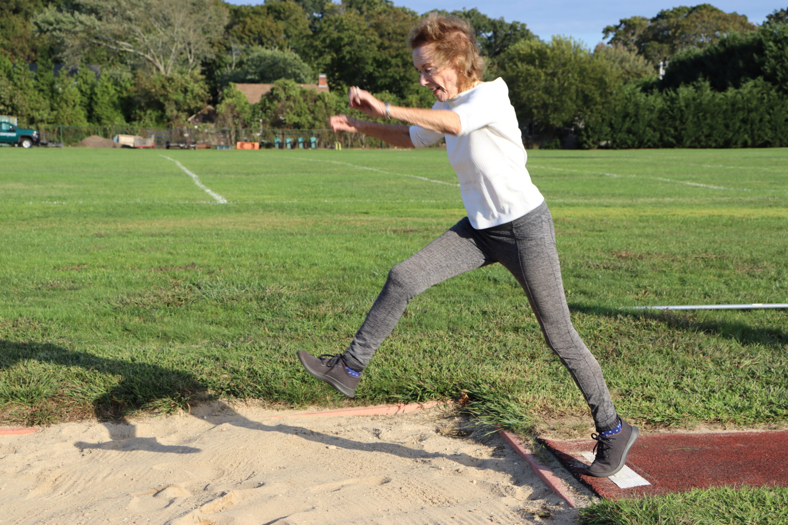 Quogue resident Hala Lawrence, 92, competed in the triple jump and long jump at a track and field event in New Jersey recently, posting distances that could potentially make her a world champion in the 90+ age group. CAILIN RILEY