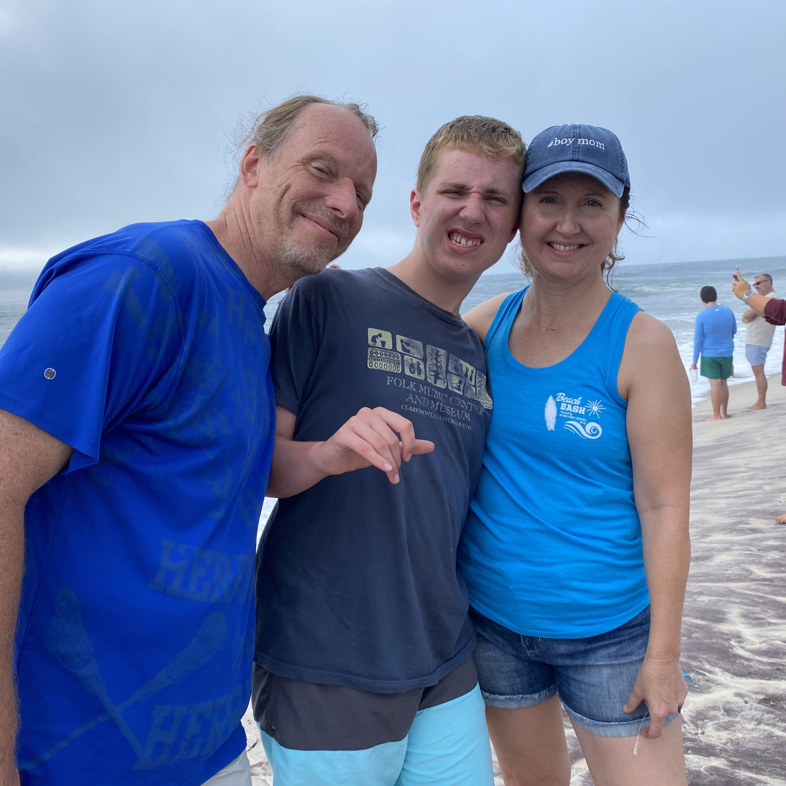 Chris, Ben and Sherri Halucha of Hampton Bays are regulars at Surfers Healing events and were thrilled when it was  held in their own “back yard.” KIM COVELL
