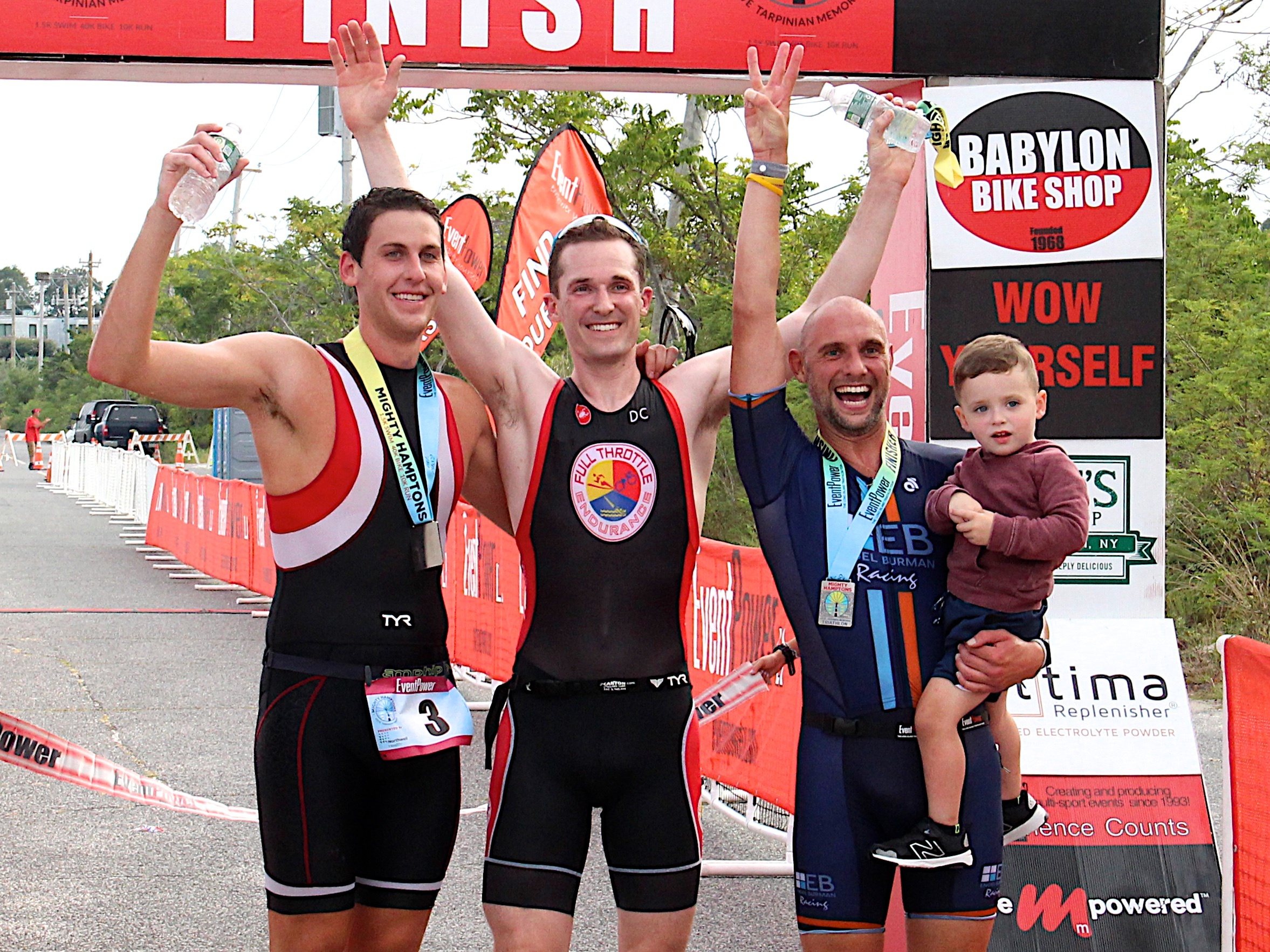 The top three finishers of this year's Steve Tarpinian Memorial Mighty Hamptons Triathlon were from left, second-place finisher Austin Quinn, champion William Huffman and third-place finisher Tim Steiskal.   KYRIL BROMLEY
