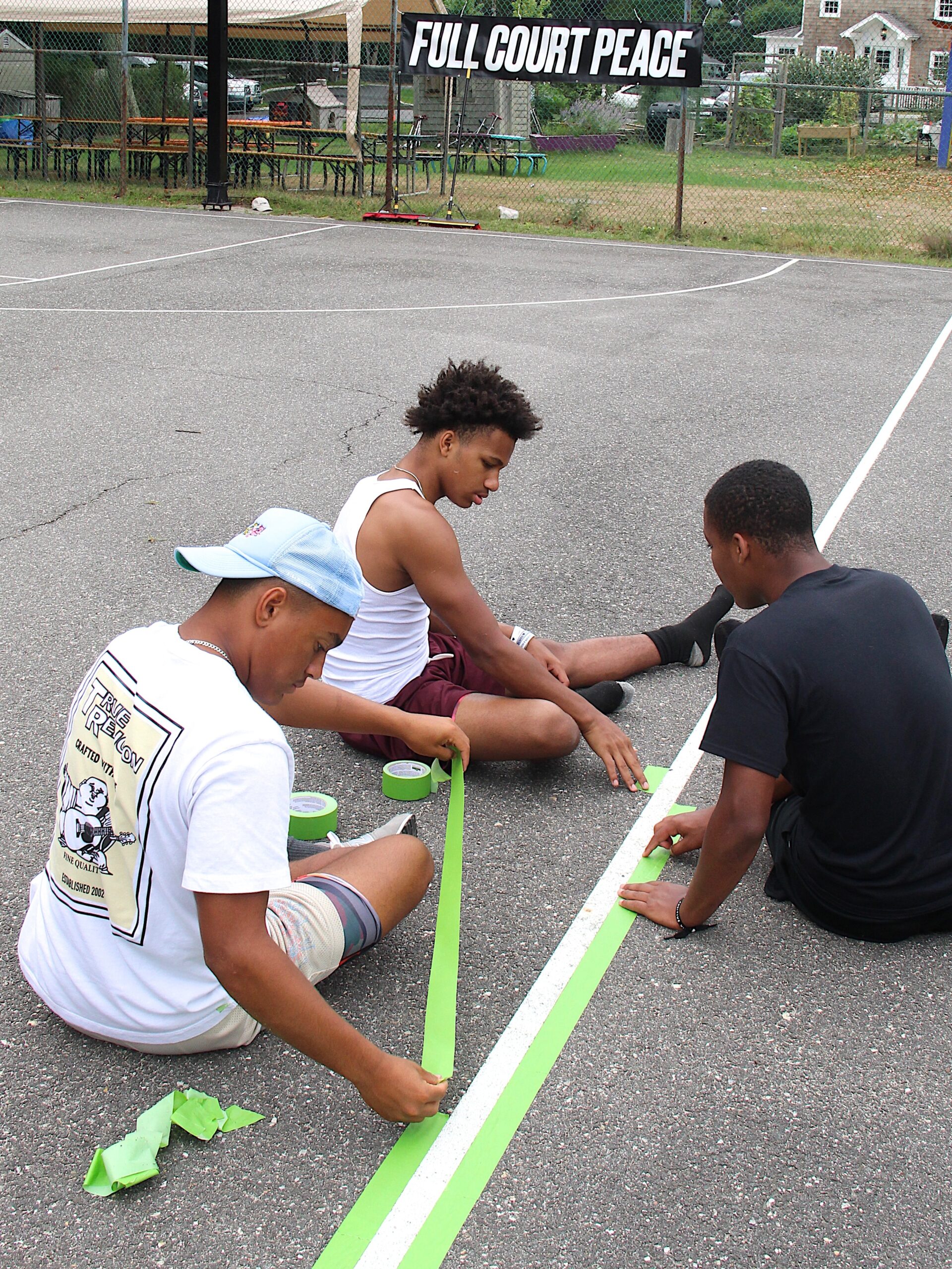 Bridgehampton varsity basketball players help out with the project.   KYRIL BROMLEY