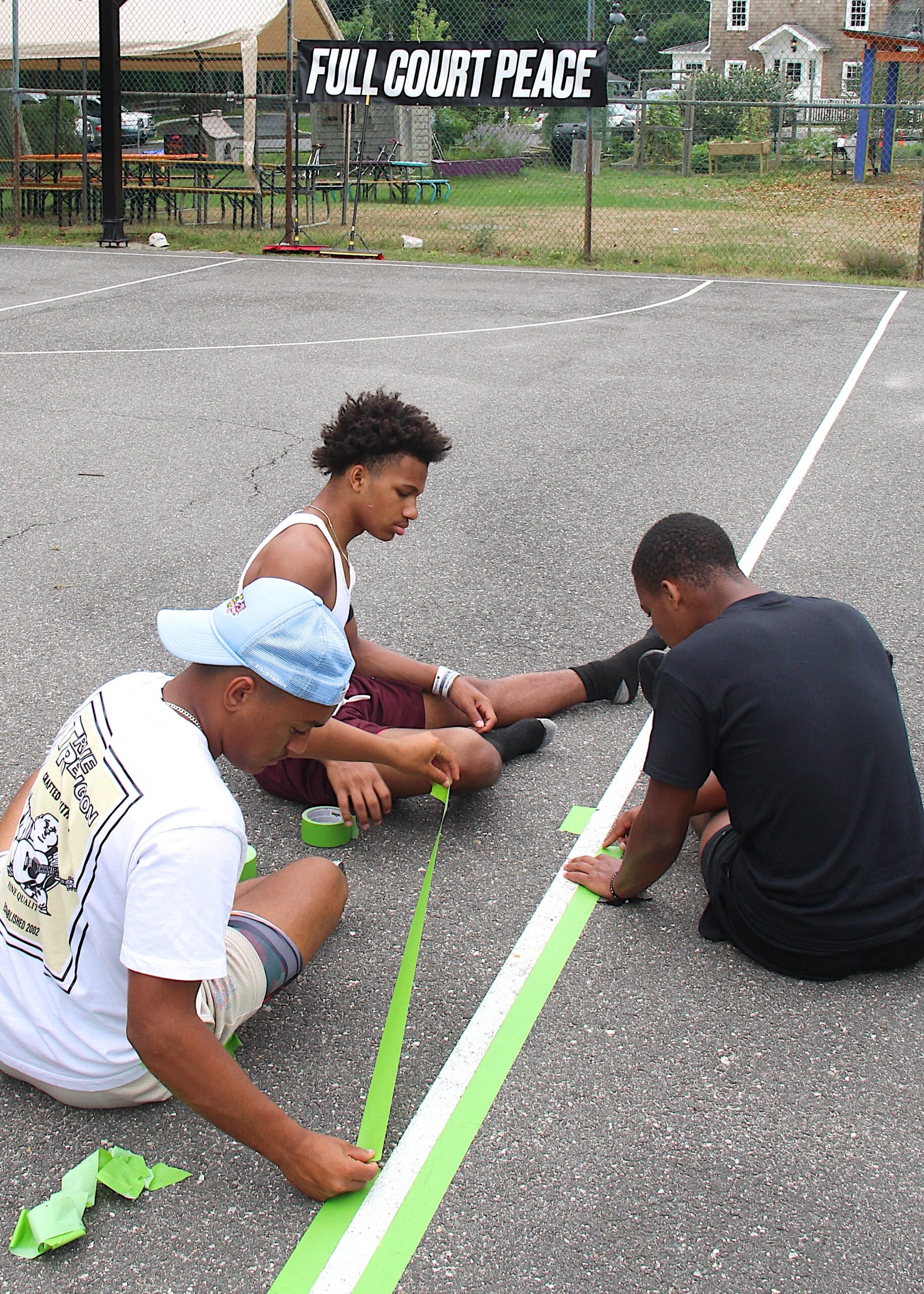 Bridgehampton varsity basketball players help out with the project.   KYRIL BROMLEY