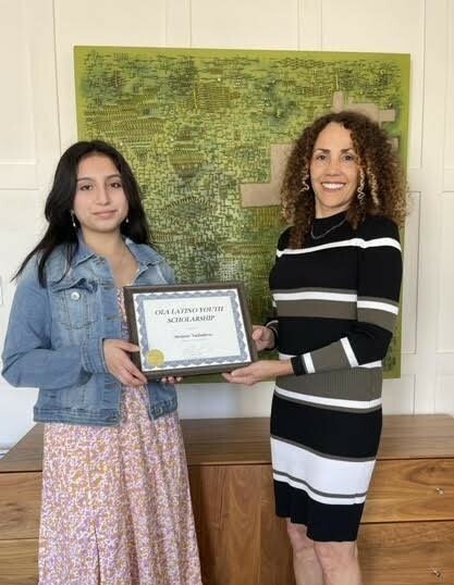 Melanie Valladares, right,  was among the recipients of an OLA scholarship. Minerva Perez, executive director of OLA, presented the award.