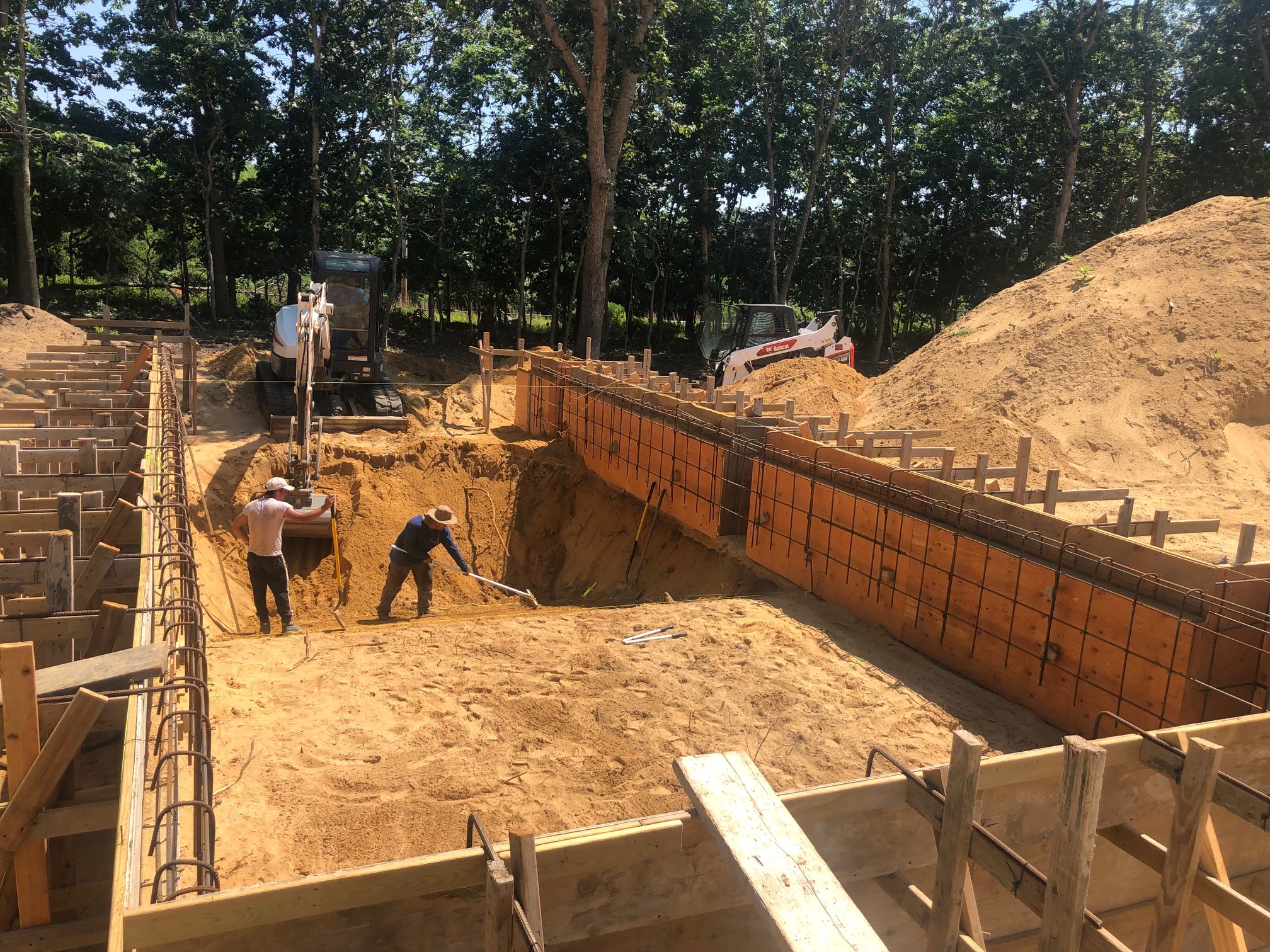 The Pristine Pools team excavates a backyard on July 20, 2022.
 COURTESY PRISTINE POOLS