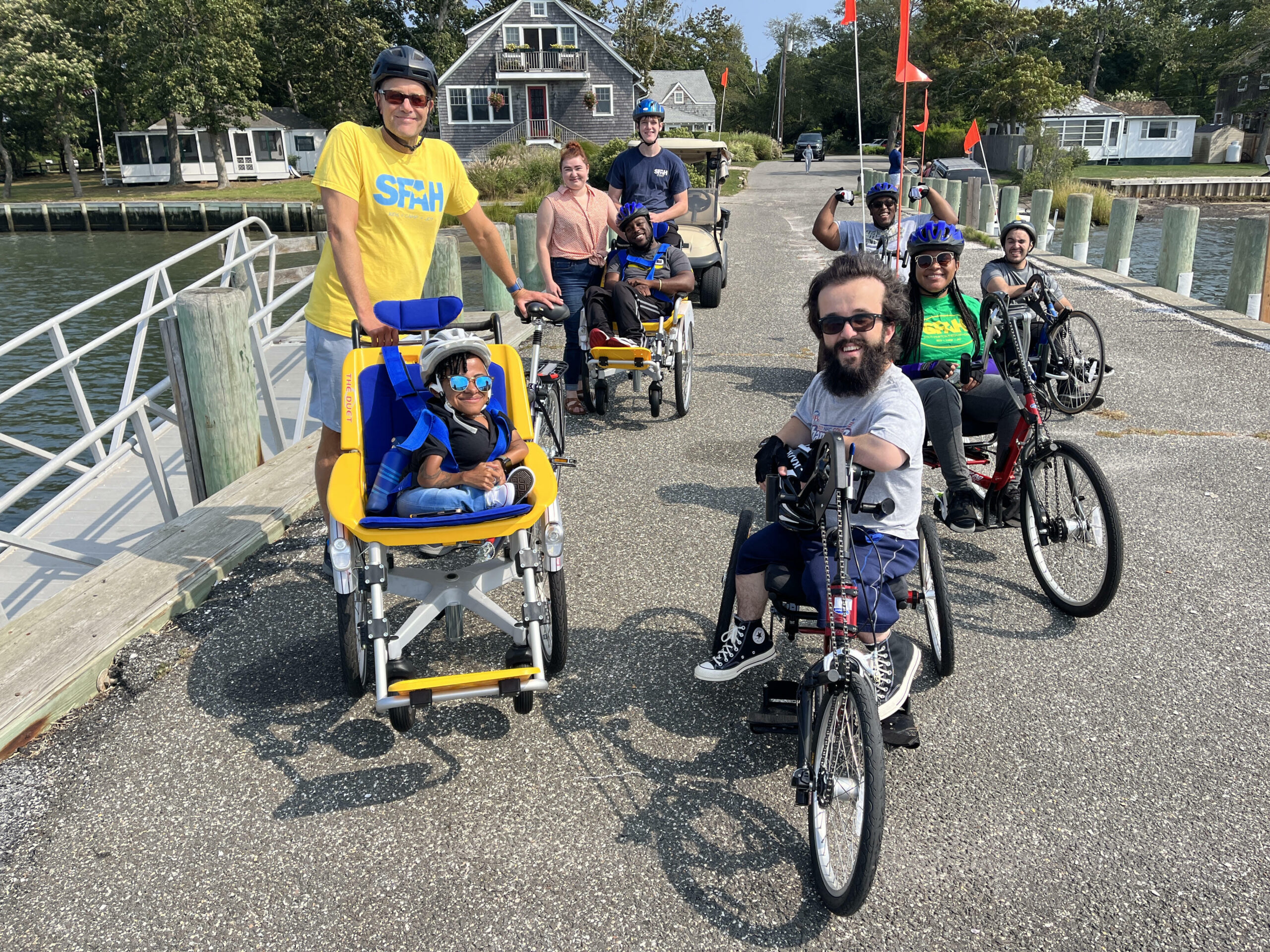 On Sunday, September 18, a group of alumni campers from Southampton Fresh Air Home participated in a 10-mile adapted bike ride in the area surrounding the camp to raise funds for the organization’s year-round programs for children with physical disabilities.  The event raised more than $3,000 with contributions still coming in. From left, front, Southampton Fresh Air Home Executive Director Tom Naro, Kiara Esteves, Brian Faithful and Johileny Meran; back, from left, Hanna and Richard Bedard, Sam Billingham, Andrew Bedard and Kevin Gomes.  DAVID BILLINGHAM/SFAH