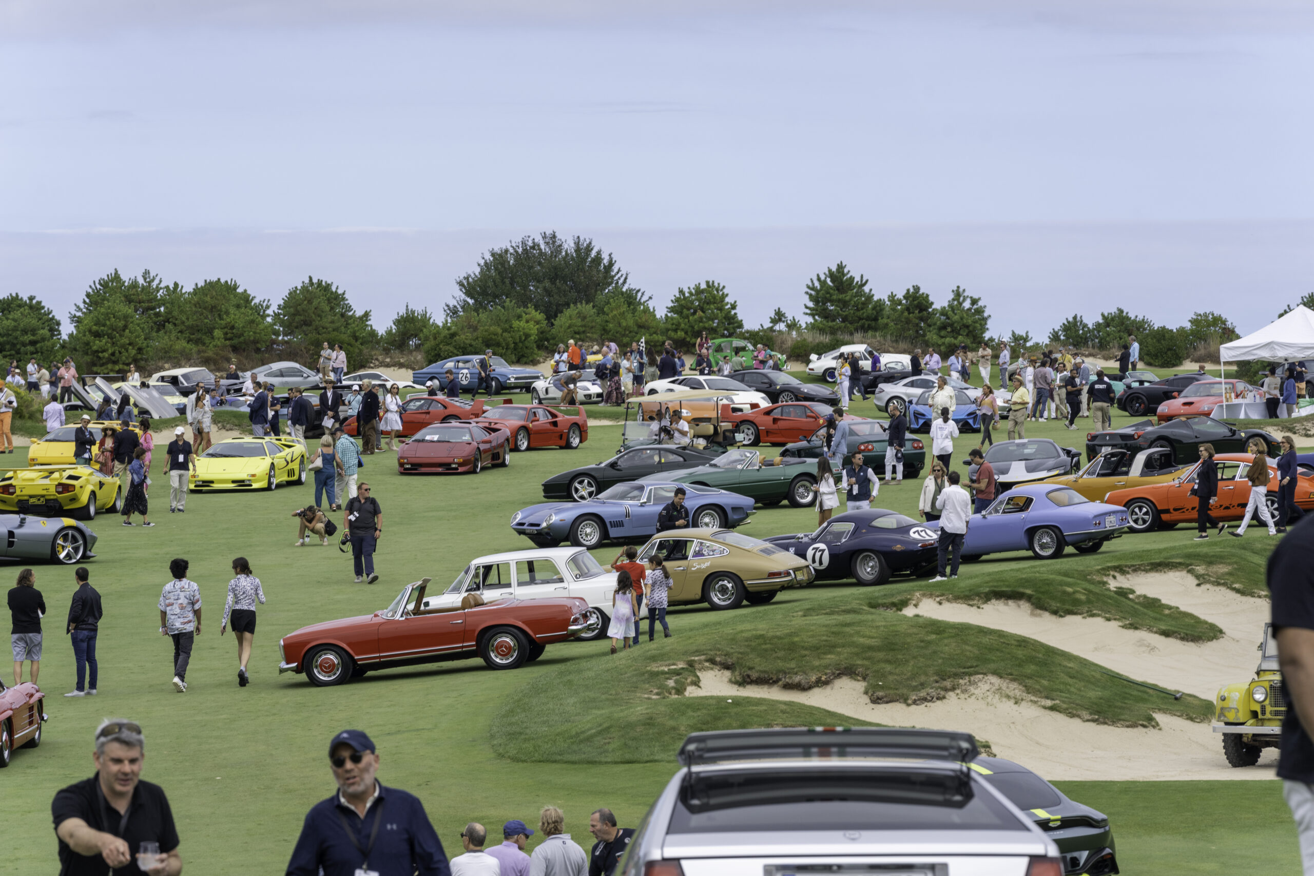 Numerous cars are sprawled out along The Bridge Golf Course.     RON ESPOSITO