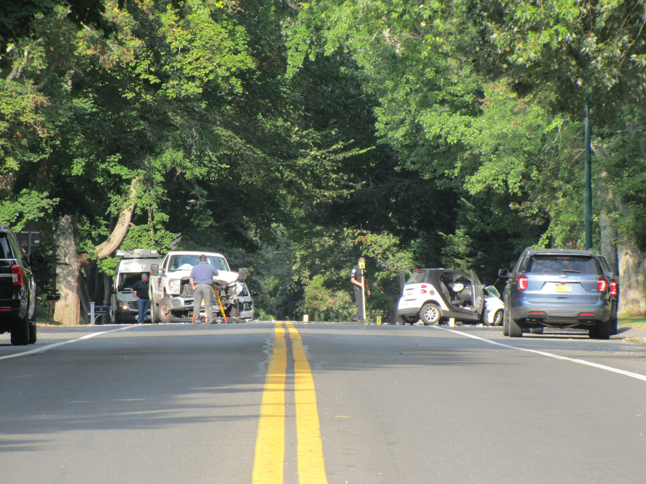 Woods Lane in East Hampton Village is closed while police reconstruct a car accident that sent a man to the hospital with severe injuries on Monday morning.