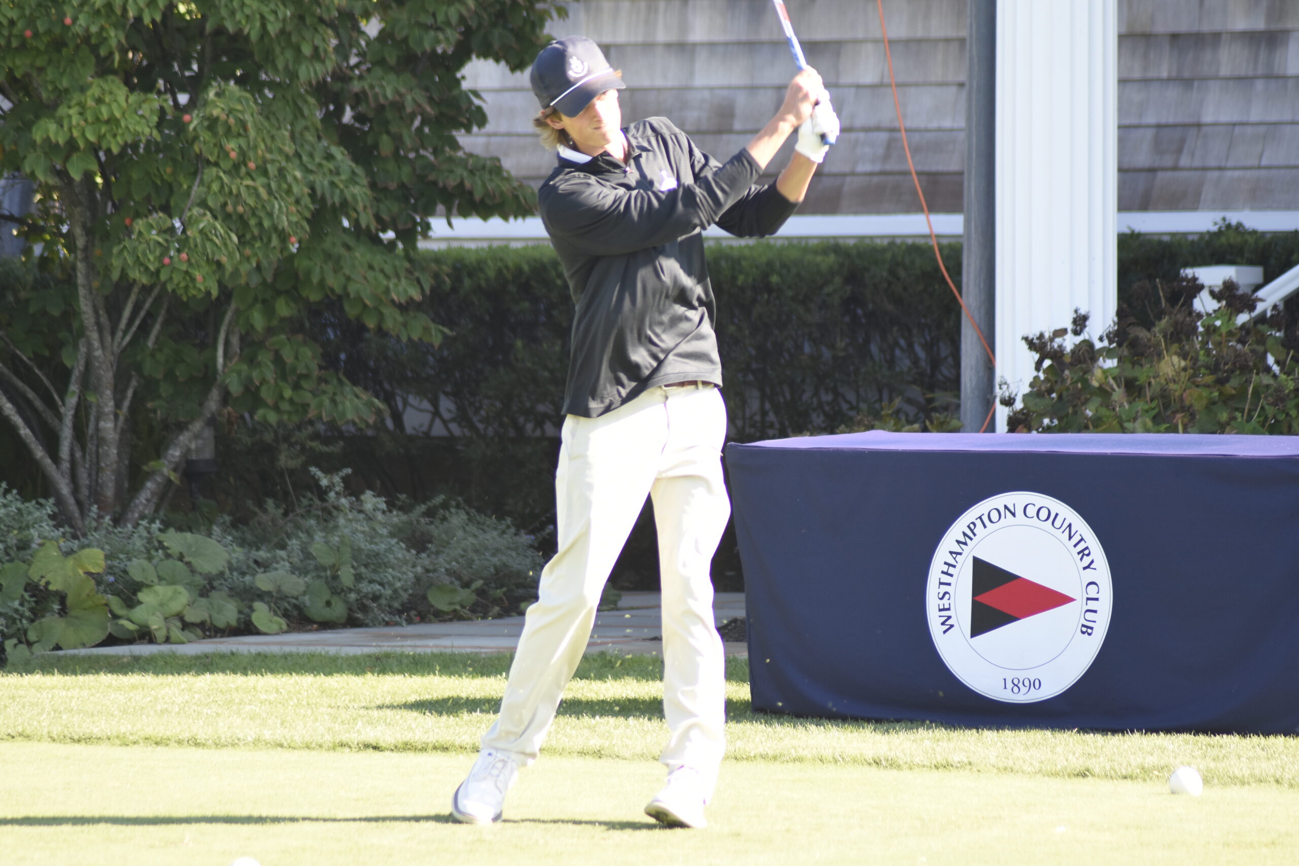 Zach Bennett of Westhampton Beach tees off at Westhampton Country Club on September 15.    DREW BUDD