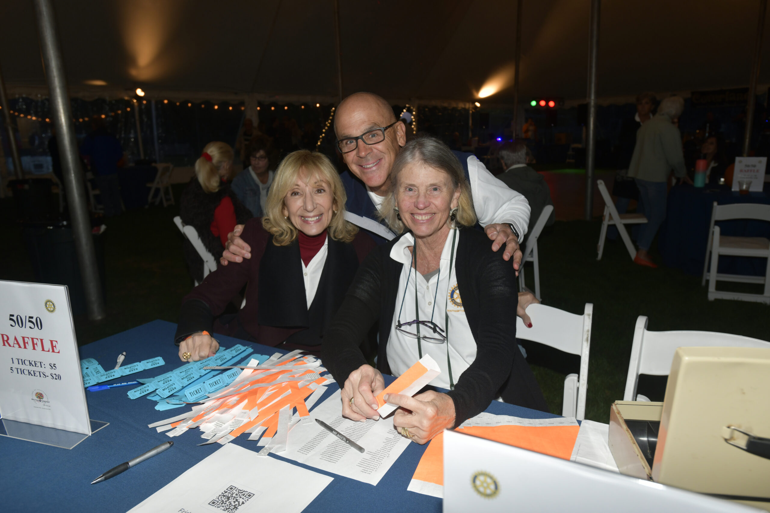 Mark Hannon, Vicki Kahn and Alexis Mayer at the Southampton Rotary Club's SouthamptonFest kick-off party on Friday night in Agawam Park.  DANA SHAW