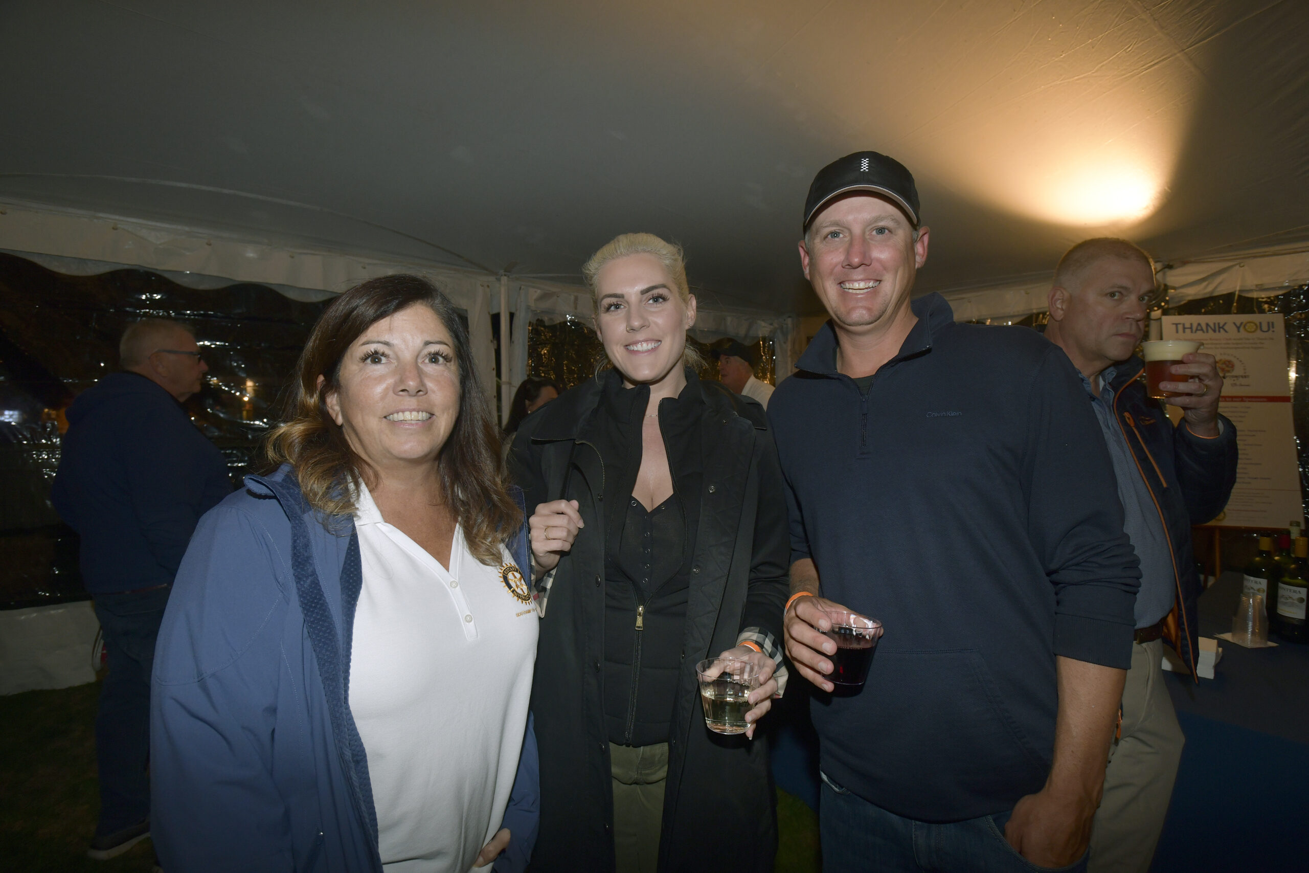 Theresa Kiernan, Maggie Heithaus and Robert Hill at the Southampton Rotary Club's SouthamptonFest kick-off party on Friday night in Agawam Park.  DANA SHAW