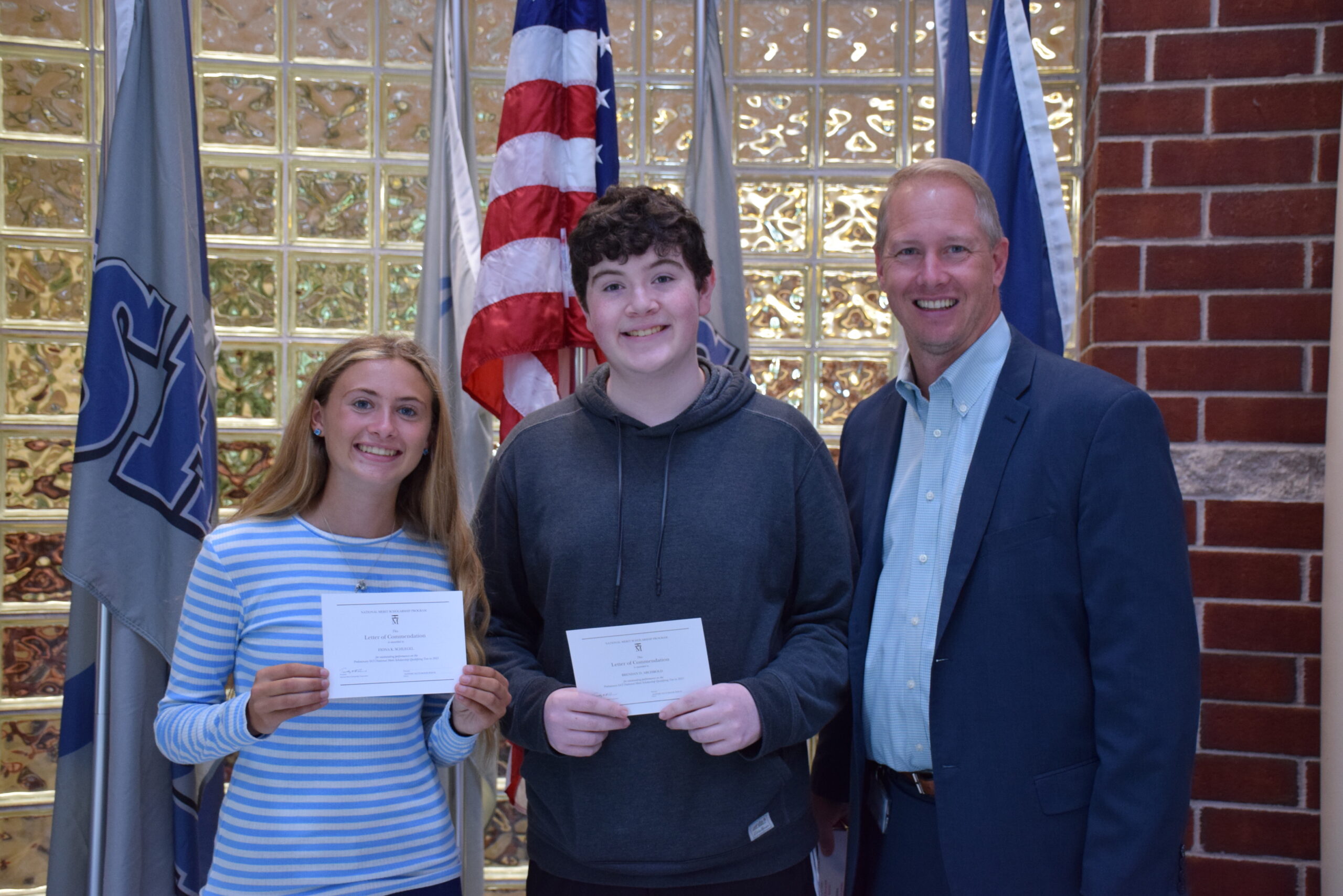 Eastport-South Manor Junior-Senior High School seniors Fiona Schlegel and Brendan
Archbold were named commended students in the National Merit Scholarship Program. They are congratulated by Principal Salvatore Alaimo. COURTESY EASTPORT-SOUTH MANOR SCHOOL DISTRICT