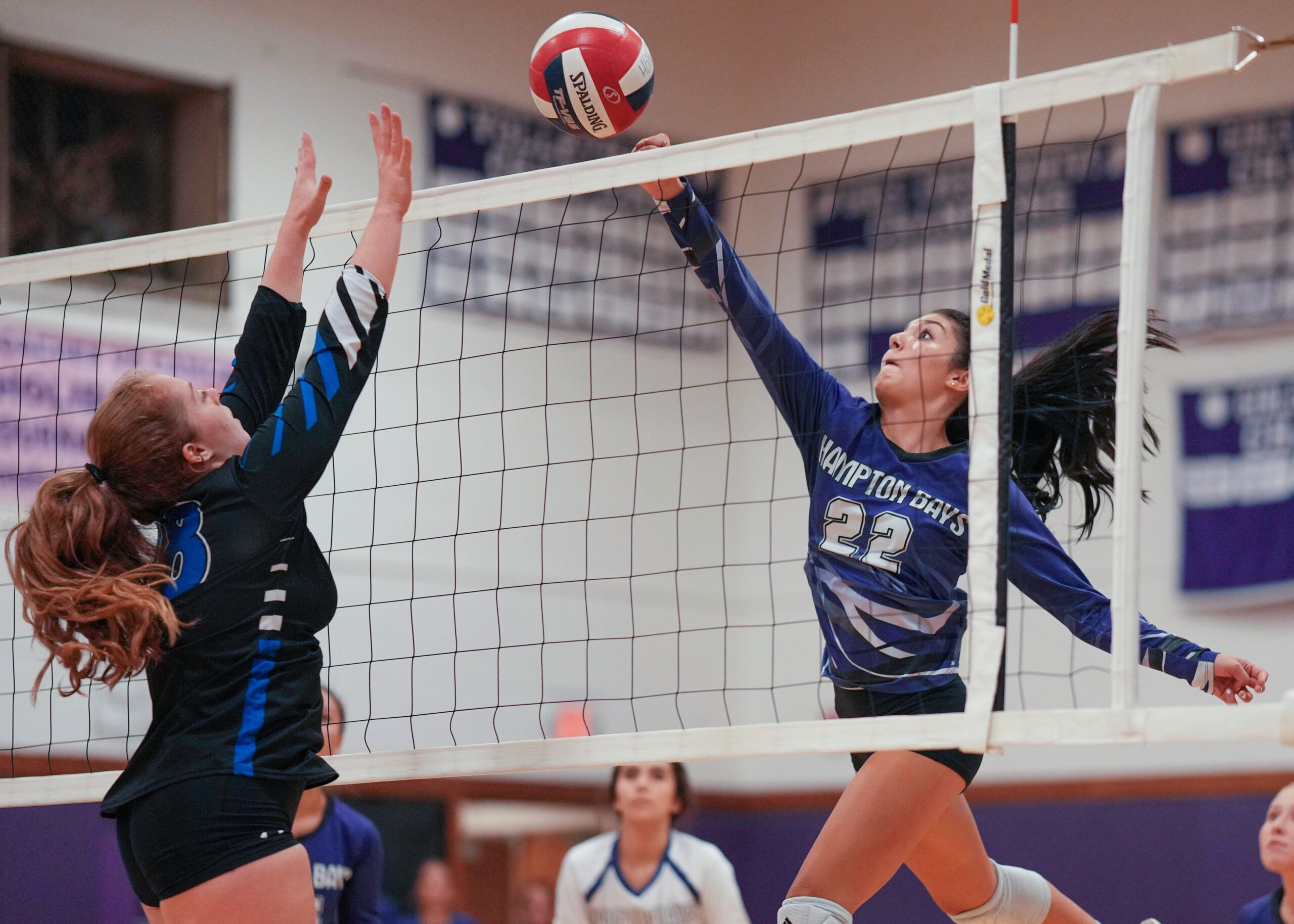 Junior outside hitter Tania Quiros sends the ball back over the net. RON ESPOSITO
