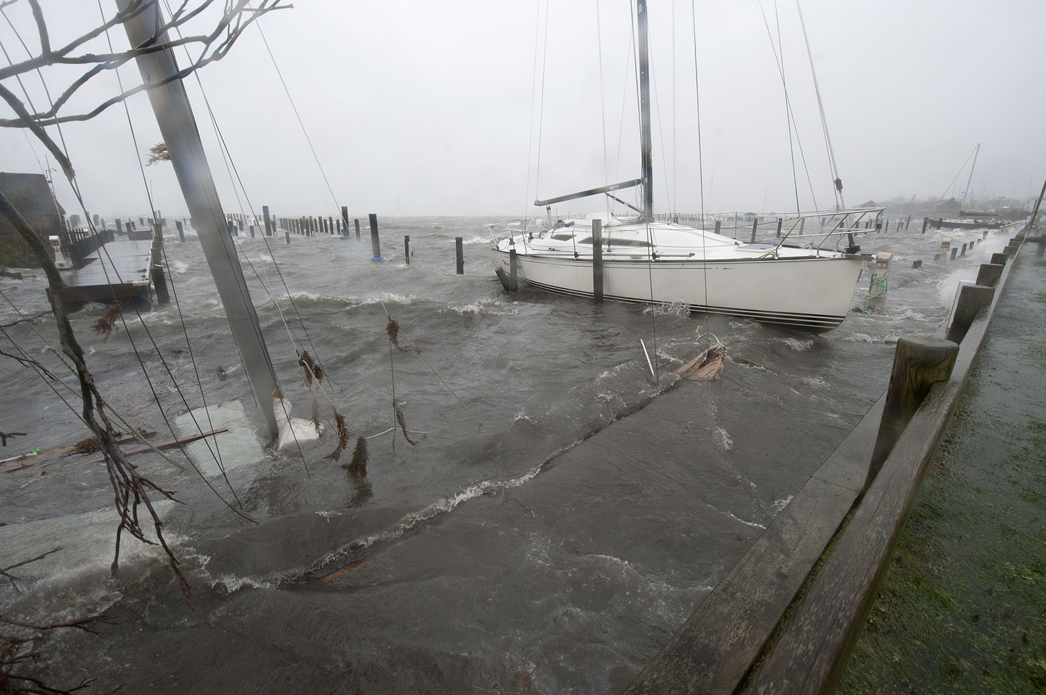 At roughly 4:00 p.m., a sailboat lay sunken at the west end of Marine Park during hurricane Sandy on Monday, October 29th, 2012.   MICHAEL HELLER