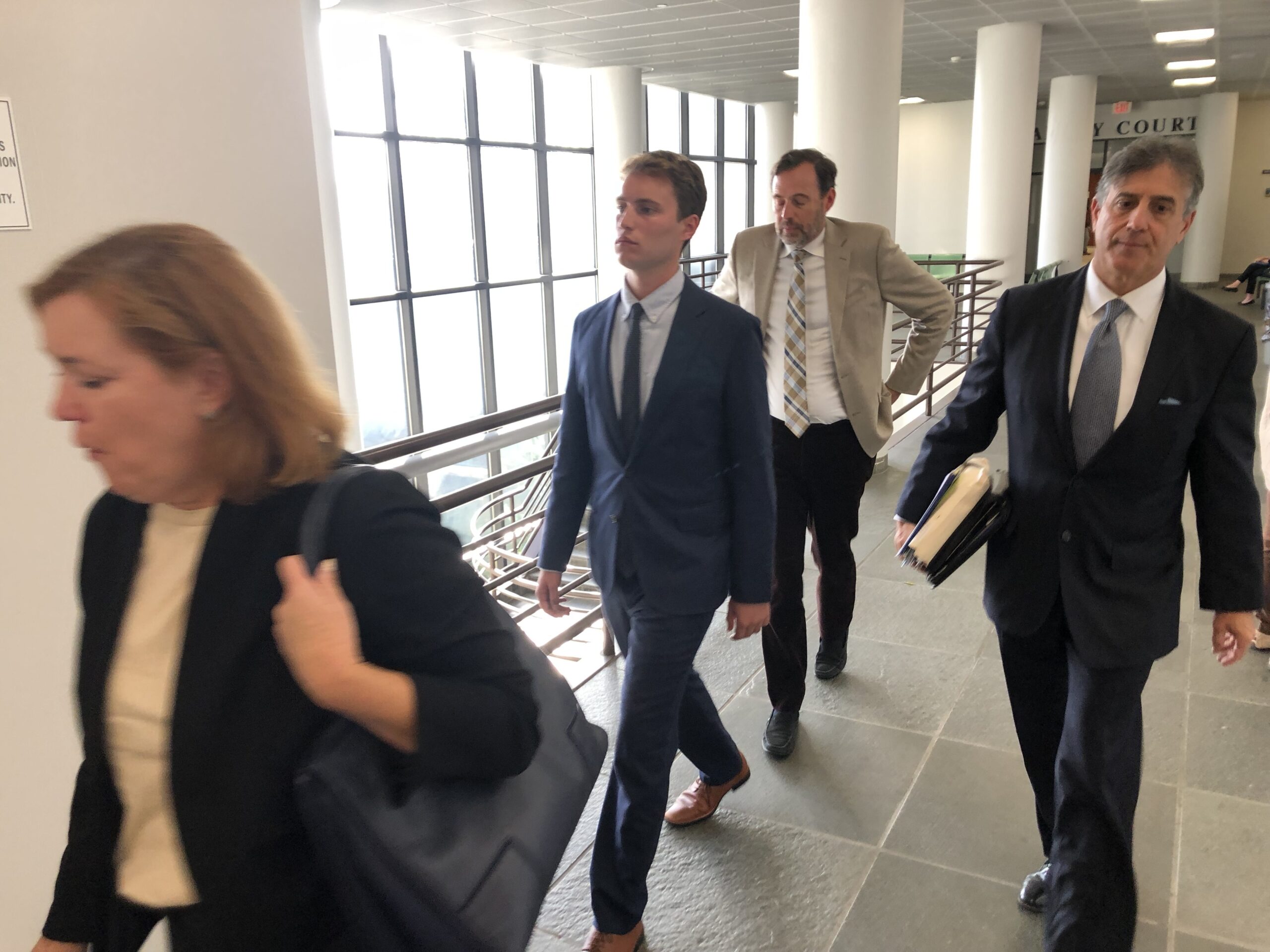 Daniel Campbell, second from left, after learning that he will serve 90 days in jail for fleeing the scene of a fatal accident in Amagansett last year. T.E. MCMORROW
