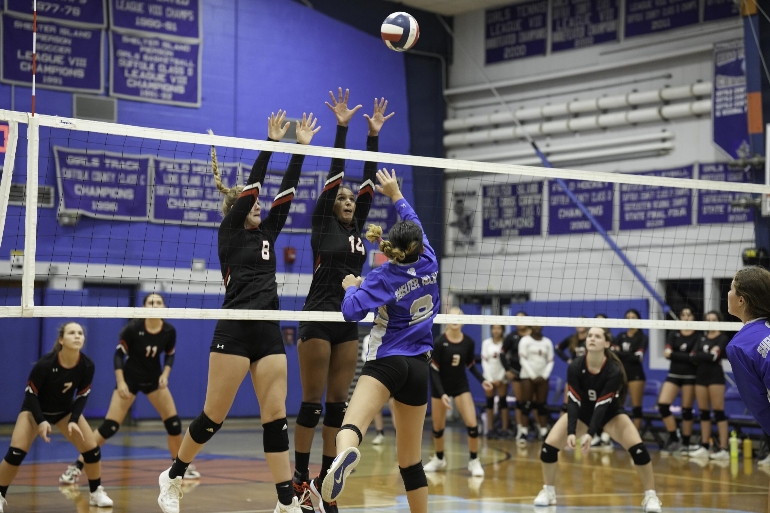 Whalers Finn Goodale, left, and Lyra Aubry go up together for a block.    RON ESPOSITO