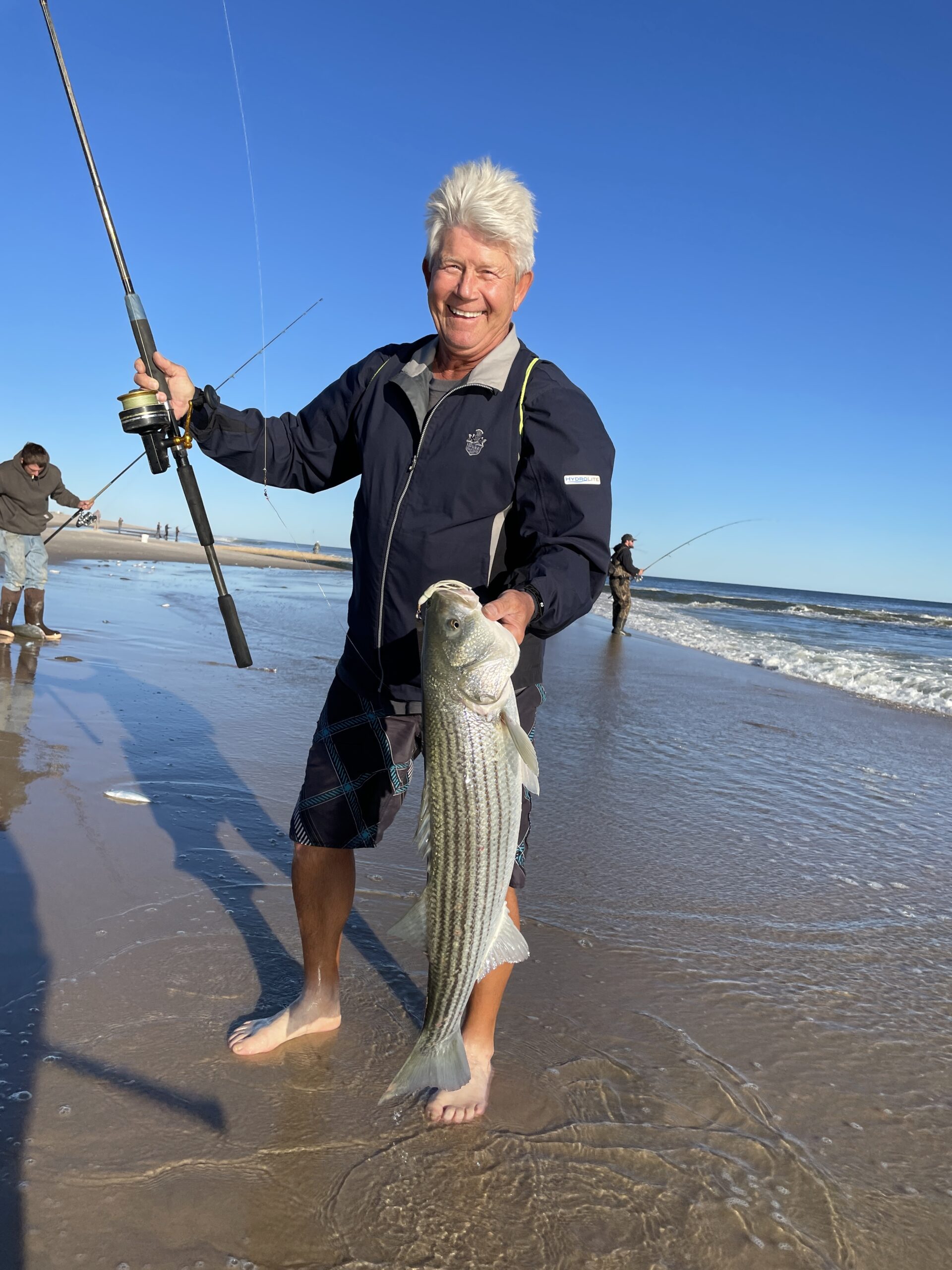 Paul Rosko with one of the striped bass that came charging into the Bridgehampton surf last week.